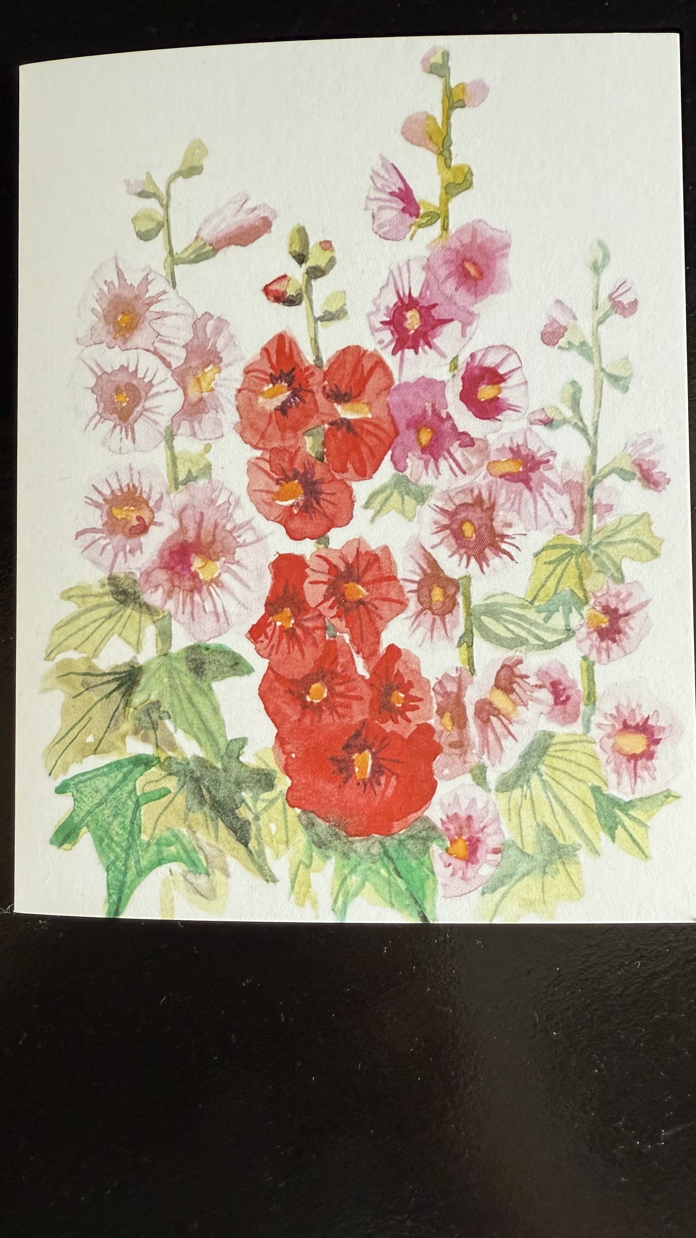 &quot;Garden Whispers &quot; - A charming watercolor card with blooming hollyhocks in vibrant shades is red, pink and magenta. Perfect for any heartfelt message, this floral design evokes the quiet be beauty os summer garden. Blank inside for your personal note - ideal for birthdays, thinking -of-you, or just because.