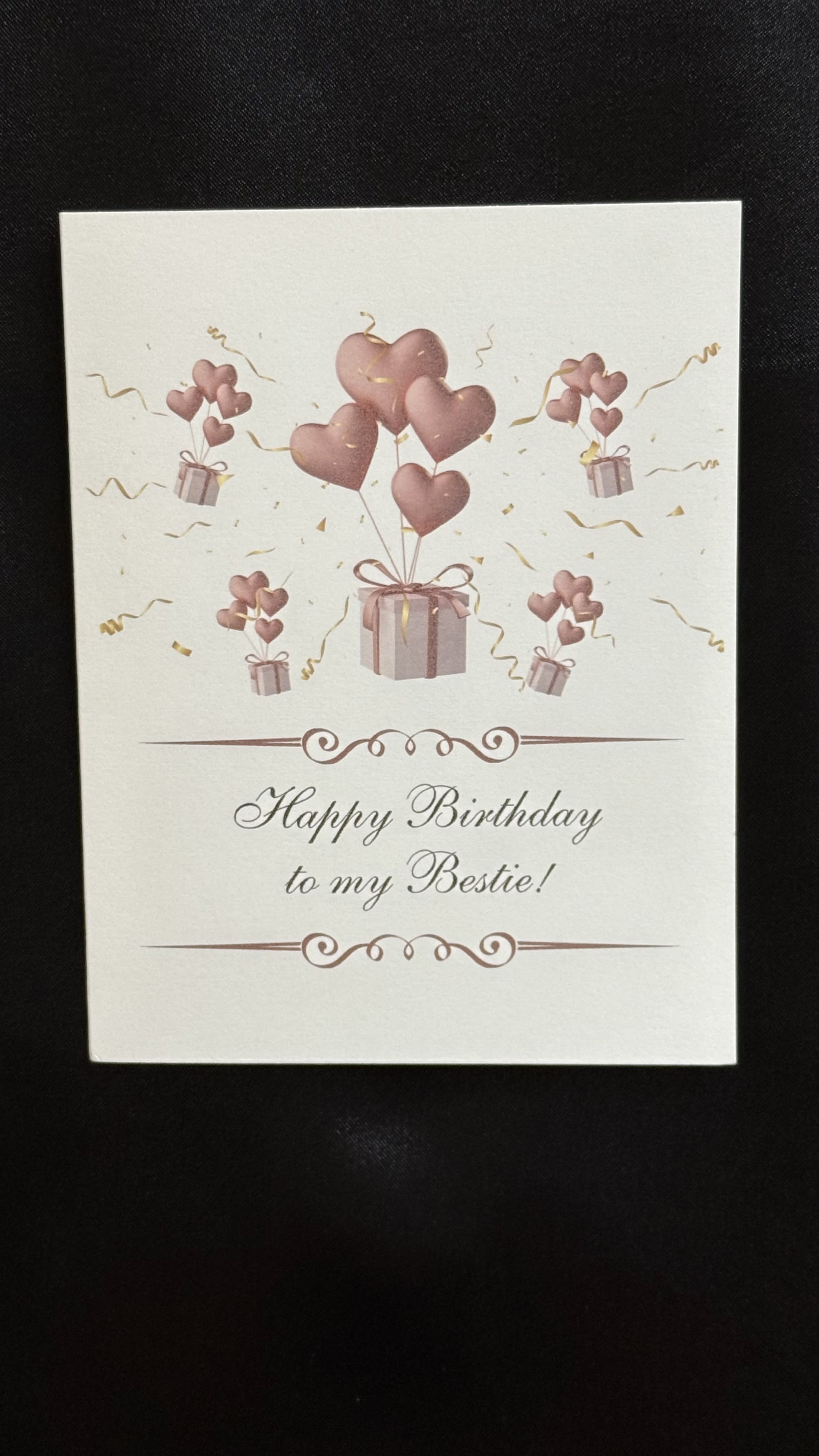 Bestie Birthday Delight  - A charming birthday card featuring  rose gold heath balloons floating from wrapped gift, surrounded by festive golden streamers. The elegant front  read perfect for celebrating your closest friend's special day with love and style.Blank inside for you heartfelt messages.