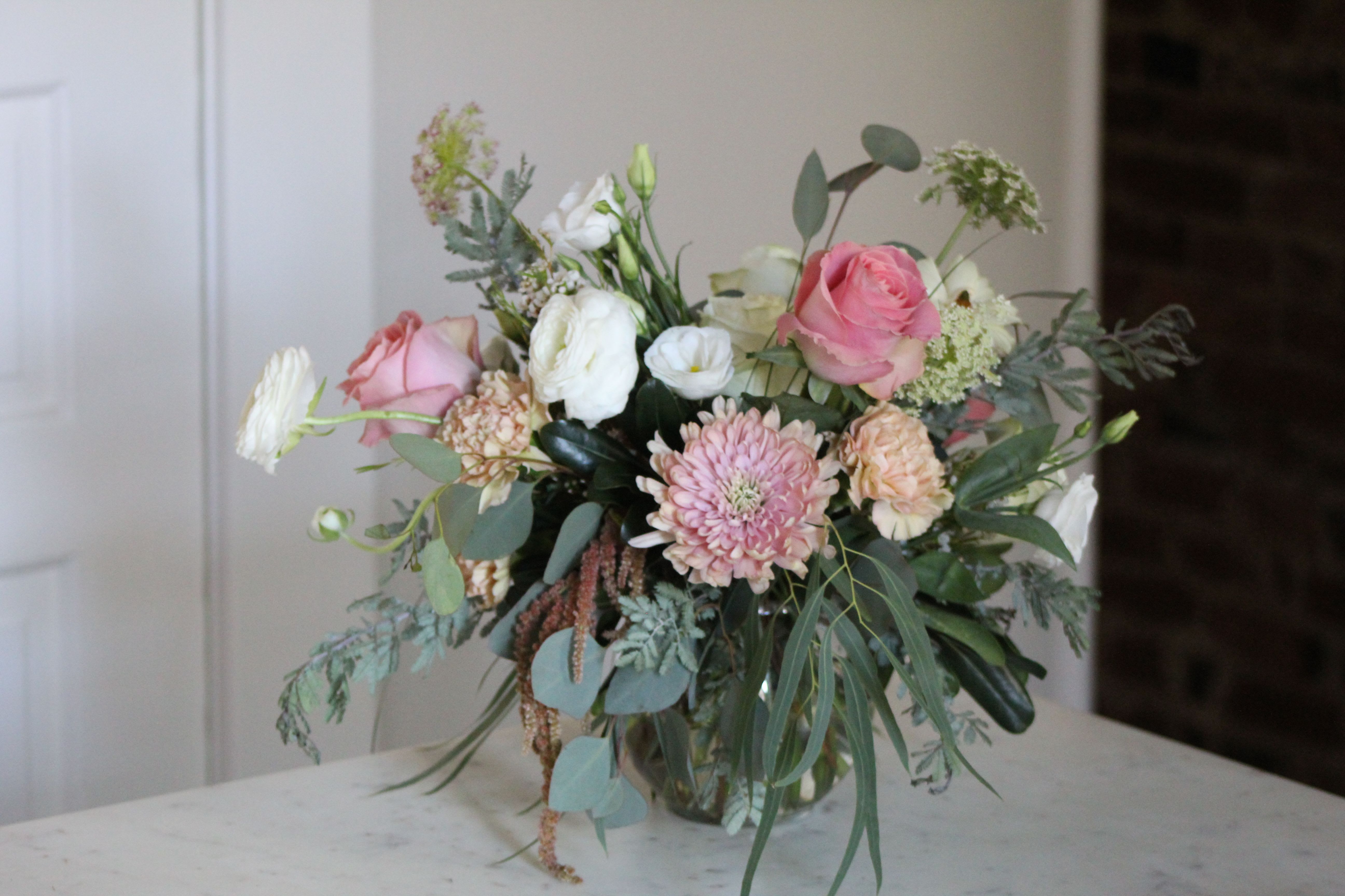 Grace - Grace is a light and dreamy arrangement with graceful and airy movement. Her soft colors and wispy greenery make her the perfect centerpiece or gift for any occasion. 