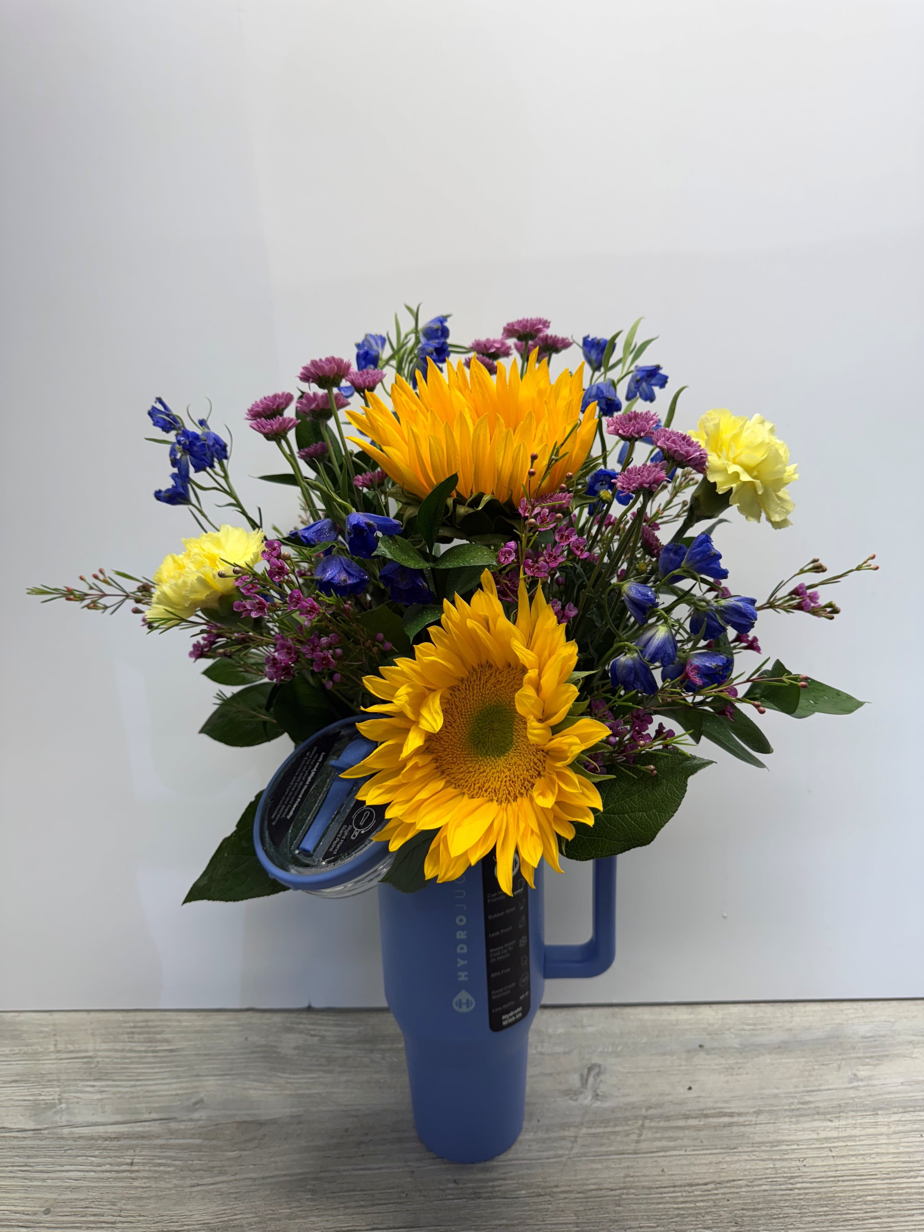 HydroJug with Designer's Choice Floral - Designer's choice of beautiful floral in a Hydrojug cup. HydroJug cup colors and flower choices may vary.   