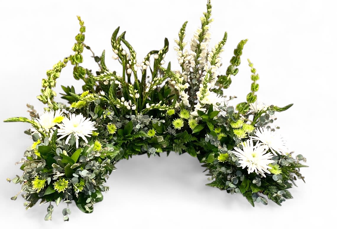 Gentle Reverence Custom Urn and Photo Memorial Tribute - A custom urn or photo arrangement is a thoughtfully crafted tribute designed to surround a loved one's remains with a personalized selection of blooms and colors that reflect their unique spirit and memory. Carefully chosen flowers and hues come together to create a heartfelt display, serving as a beautiful homage that honors their life and legacy. This bespoke arrangement offers a meaningful and comforting visual tribute, celebrating their individuality while providing a touching reminder of the love and connection shared. (Urn or Photo not included.)