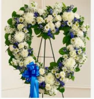 Heart Heart - It has white cremone, white carnations, white rose, white Daisies, blue dilphinium & filler