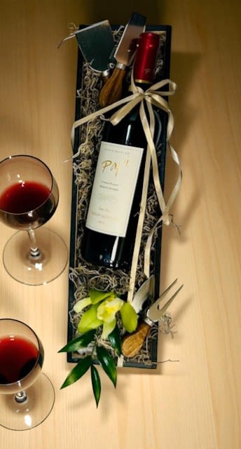 Cheers &amp; Bloom Box Set Papi Cabernet  - Cheers &amp; Bloom is a refined gift box designed for thoughtful giving. Presented in a sleek black wooden box, it includes a bottle of Papi Cabernet, a wine aerator, artisan cheese tools, and a fresh orchid bloom. Sophisticated and elegant, it's the perfect gesture to celebrate life’s special moments with taste and style. Upgrade the wine by selecting the Deluxe or Premium option at checkout.  To order wine from our catalog, both the customer and recipient must be at least 21 years old. Valid ID will be required upon delivery. By placing an order, you confirm that you and the recipient are of legal drinking age.
