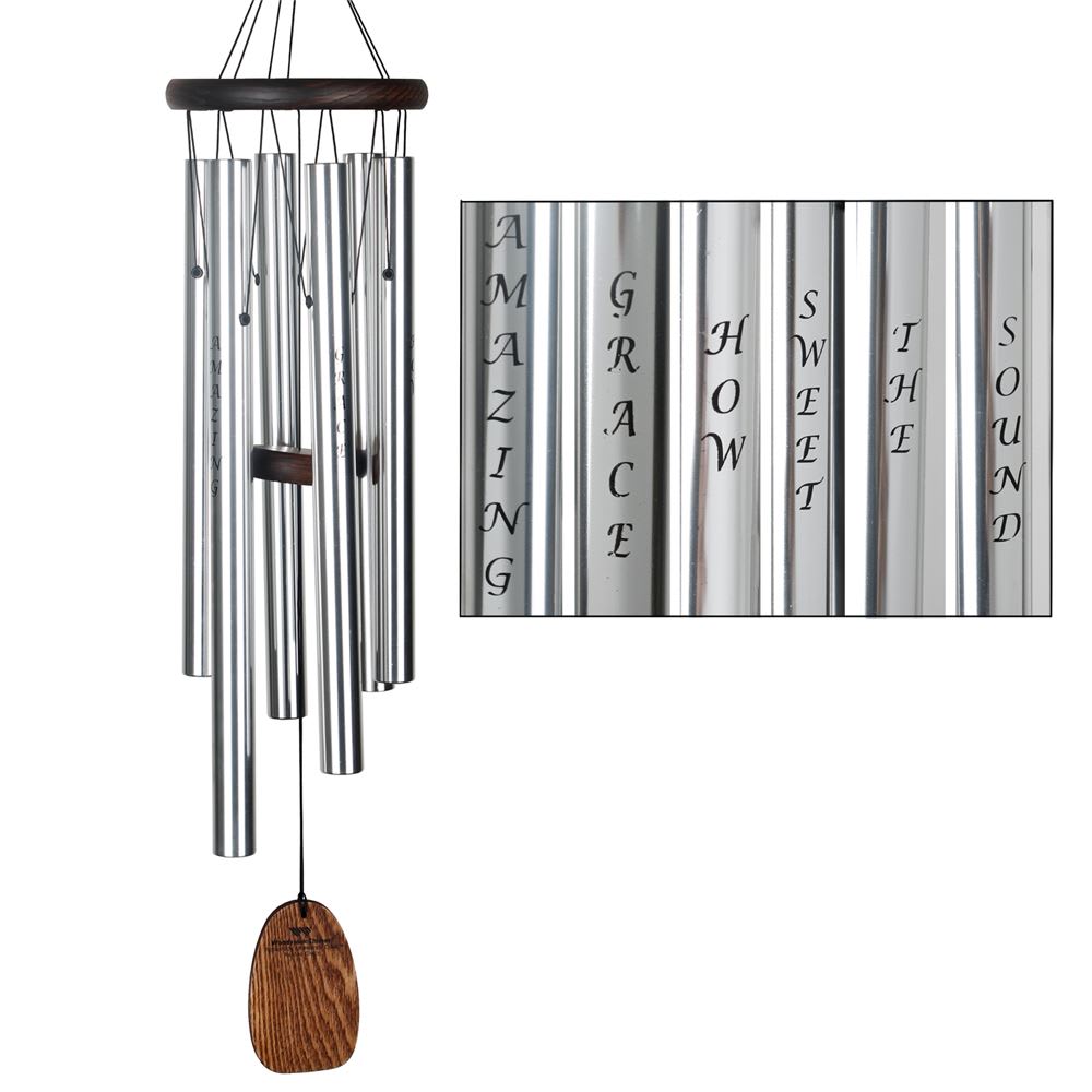 Amazing Grace Wind Chimes Amazing Grace Wind Chimes - Affirmations are used to support and encourage our highest ideals and hopes. When affirmations are repeated, they strengthen our resolve and empower us to turn our dreams into reality. May the hymn's uplifting message of hope from over 200 years ago resonate with you today, focusing your thoughts and serving as an affirmation of all that is good in life. AMAZING GRACE This chime is tuned to the opening notes of Amazing Grace, this chime features the first six words of the hymn (Amazing Grace, how sweet the sound), silk-screened on the tubes. I once was lost, but now am found Was blind, but now I see -John Newton Dimensions: 25 in. Overall Length Material: Teak finish ash wood, 6 silver silk-screened tubes, removable windcatcher for easy customization