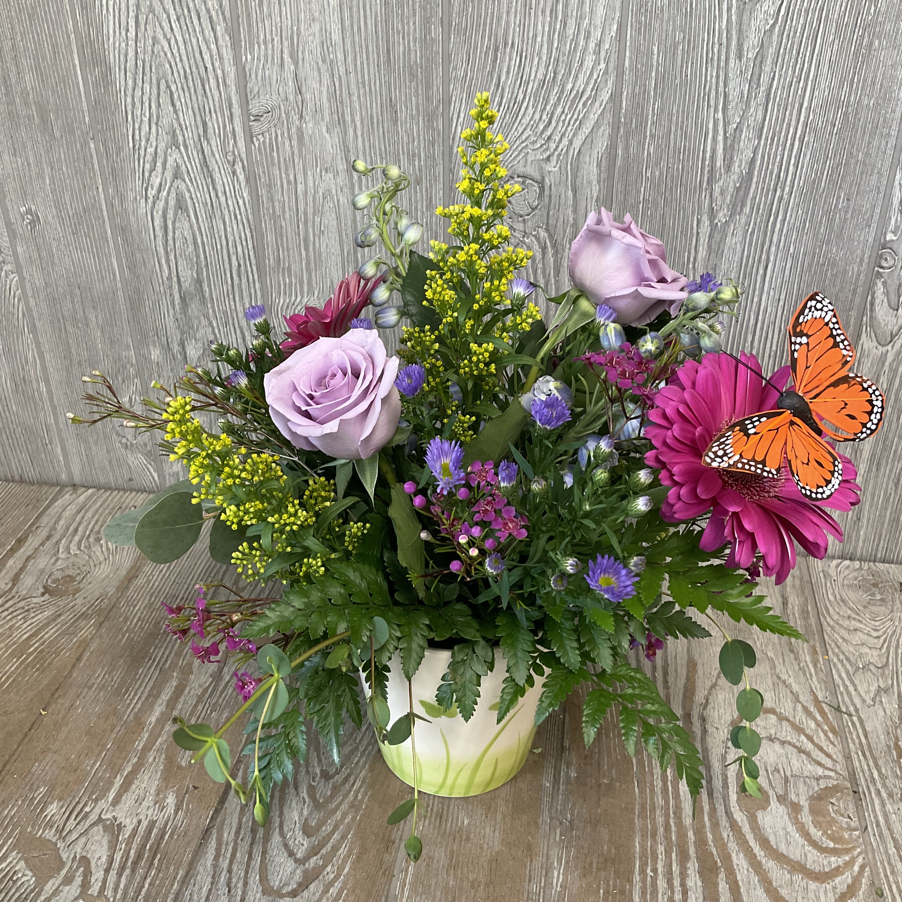 Nikki's Butterfly Garden - Colorful mix of blooms with butterflies fluttering around. Flower colors and types might vary. We have the container in 3 different colors. 