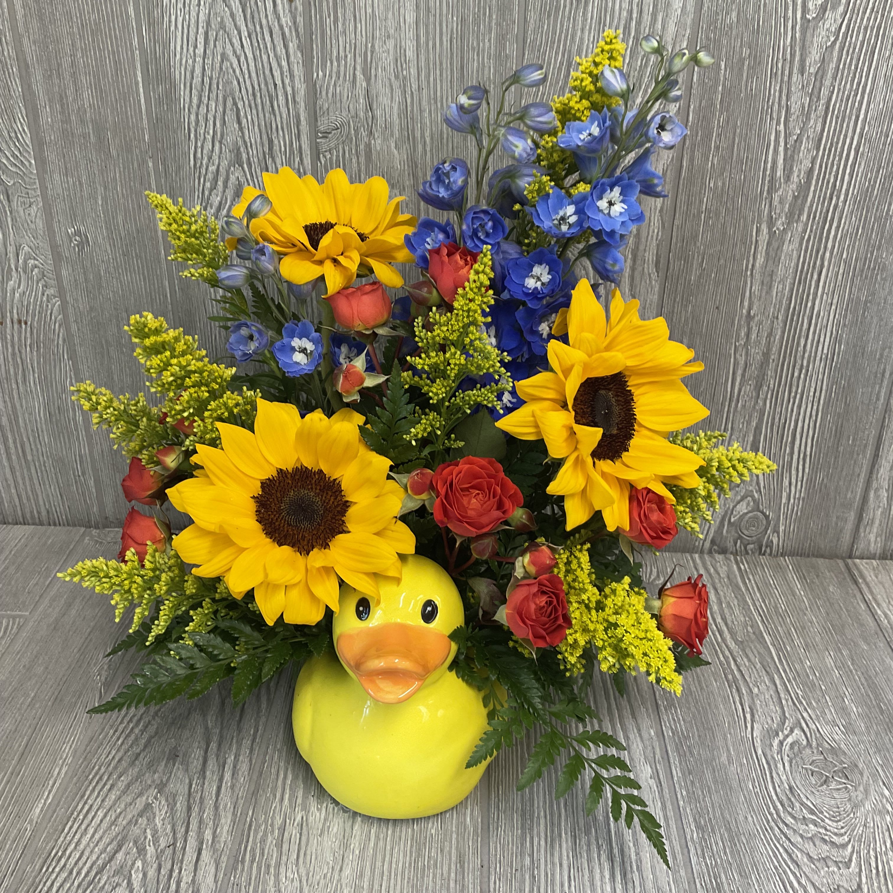 Quackers  - Fresh cut flowers arranged in a keepsake ceramic rubber duck container. Flowers and colors may vary. 