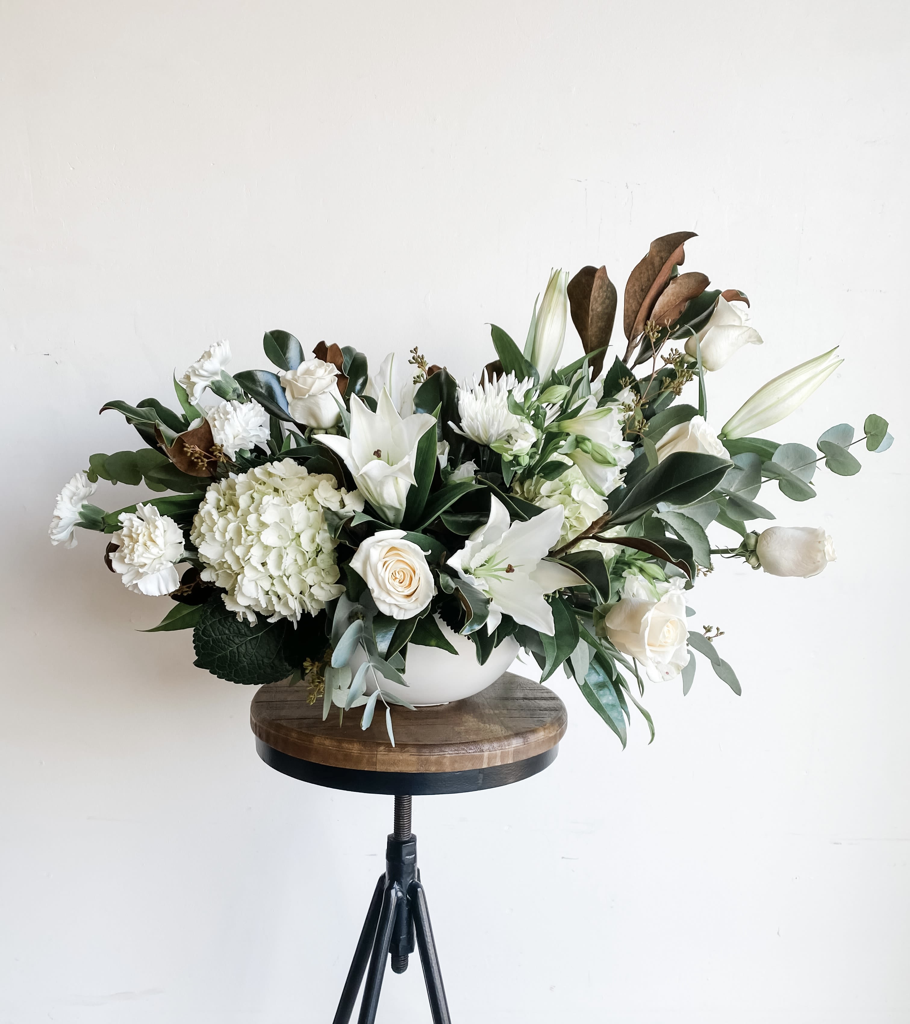 Cloud Nine Cloud Nine - Soft, serene, and effortlessly elegant — Cloud Nine is a timeless floral arrangement designed to bring a sense of calm beauty into any space. Featuring creamy white roses, lush hydrangeas, delicate lilies, and airy textures of seasonal foliage, this piece evokes the feeling of being gently wrapped in a passing cloud. Perfect for weddings, sympathy, or moments that call for quiet luxury and grace. - Folsom CA florist