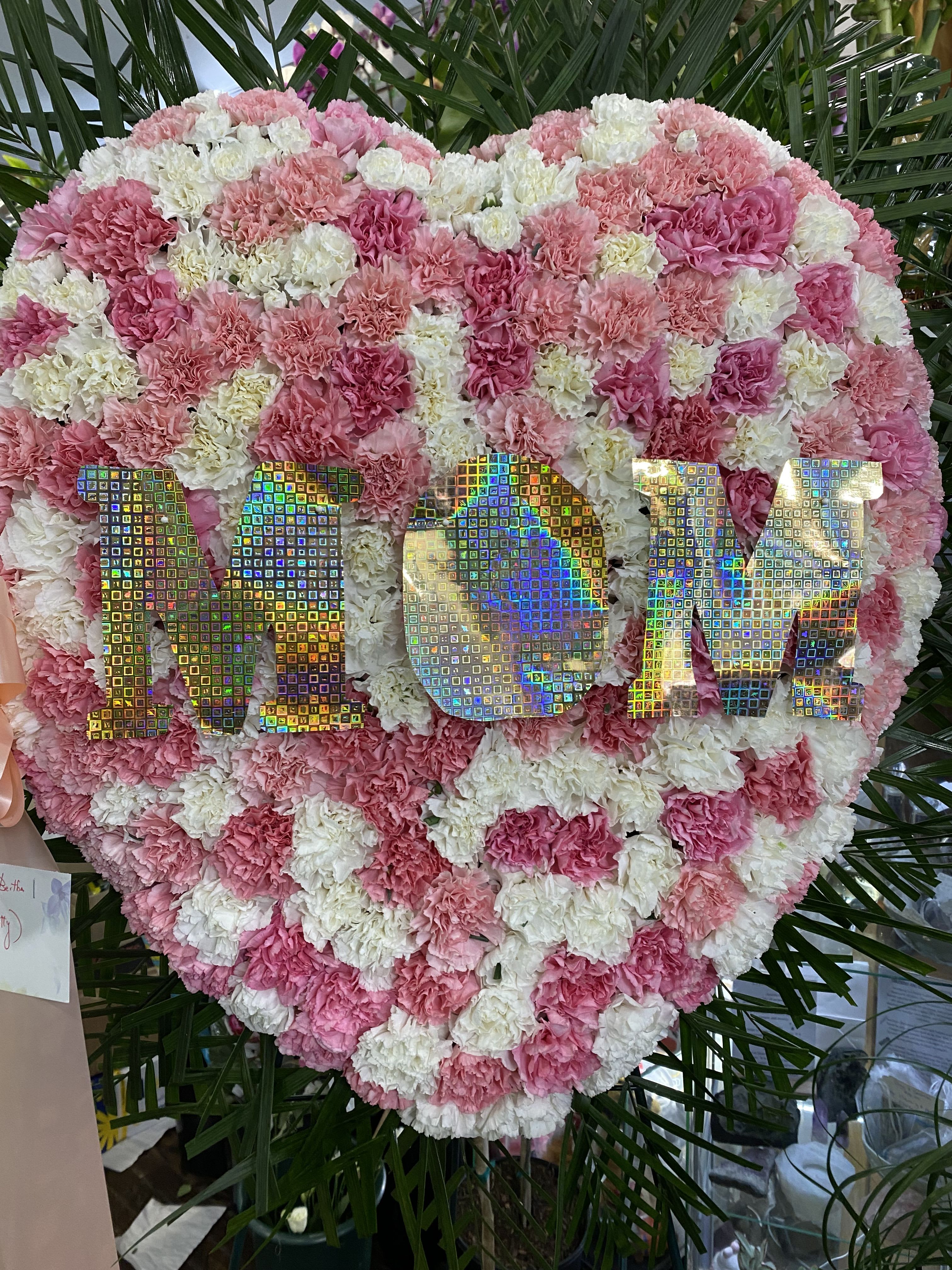 Full Mom Heart - This funeral arrangement is a heartfelt and tender tribute designed to honor the profound and unconditional love of a mother. It embodies the warmth, strength, and boundless affection that only our mothers can provide. 