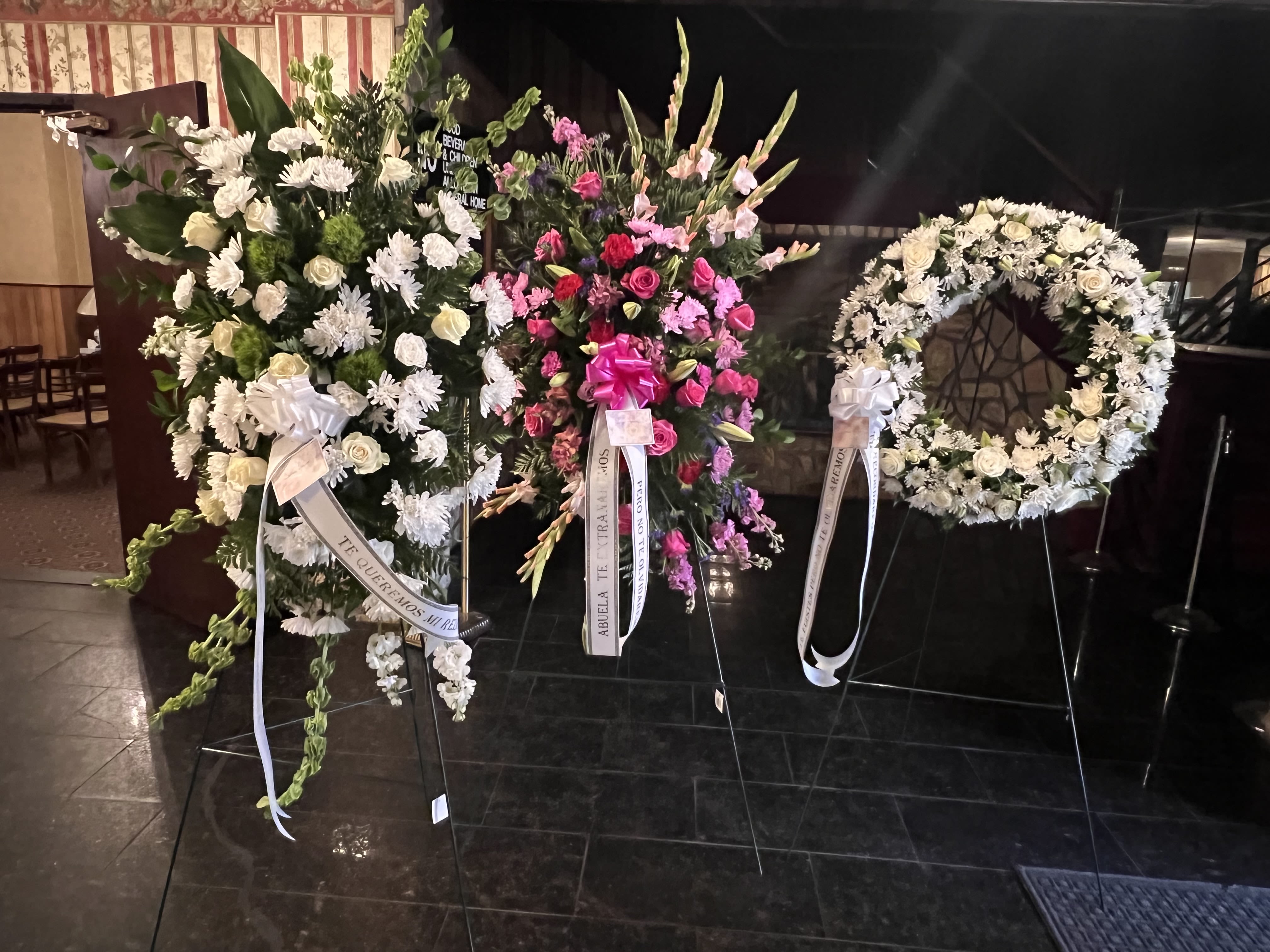 Goodbye Set - This set includes two sprays, and a wreath, becoming a cohesive and beautiful floral tribute during a time of loss. This coordinated collection ensures a harmonious and dignified presence, allowing you to express your deepest sympathies with grace and elegance. (A floor basket is included)