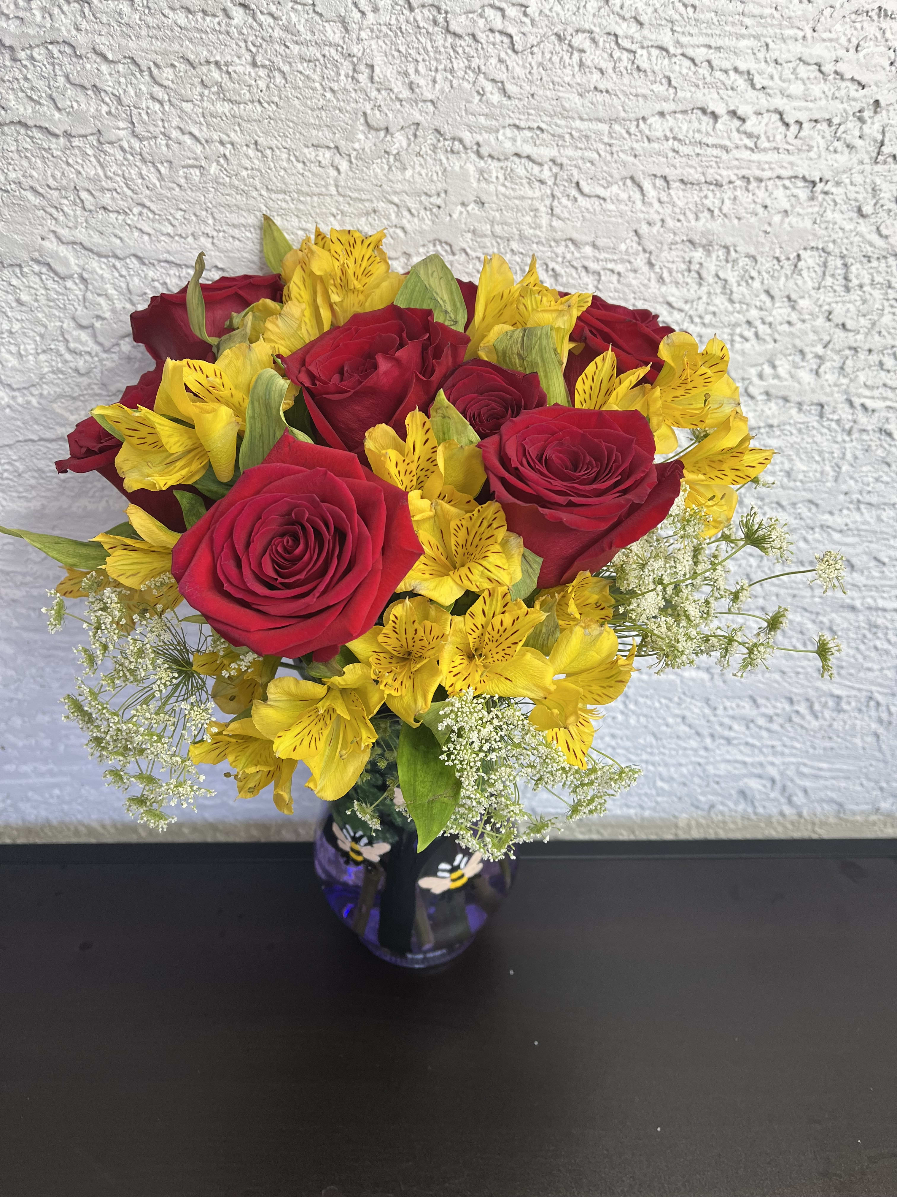  Golden Alstroemeria &amp; Red Rose Bouquet - This radiant bouquet features cheerful yellow alstroemeria blooms beautifully complemented by deep red roses, all arranged in a clear glass vase with a decorative bow. A perfect gift to express joy, admiration, or heartfelt love for any special occasion. Ribbon color and vase may vary based on availability.