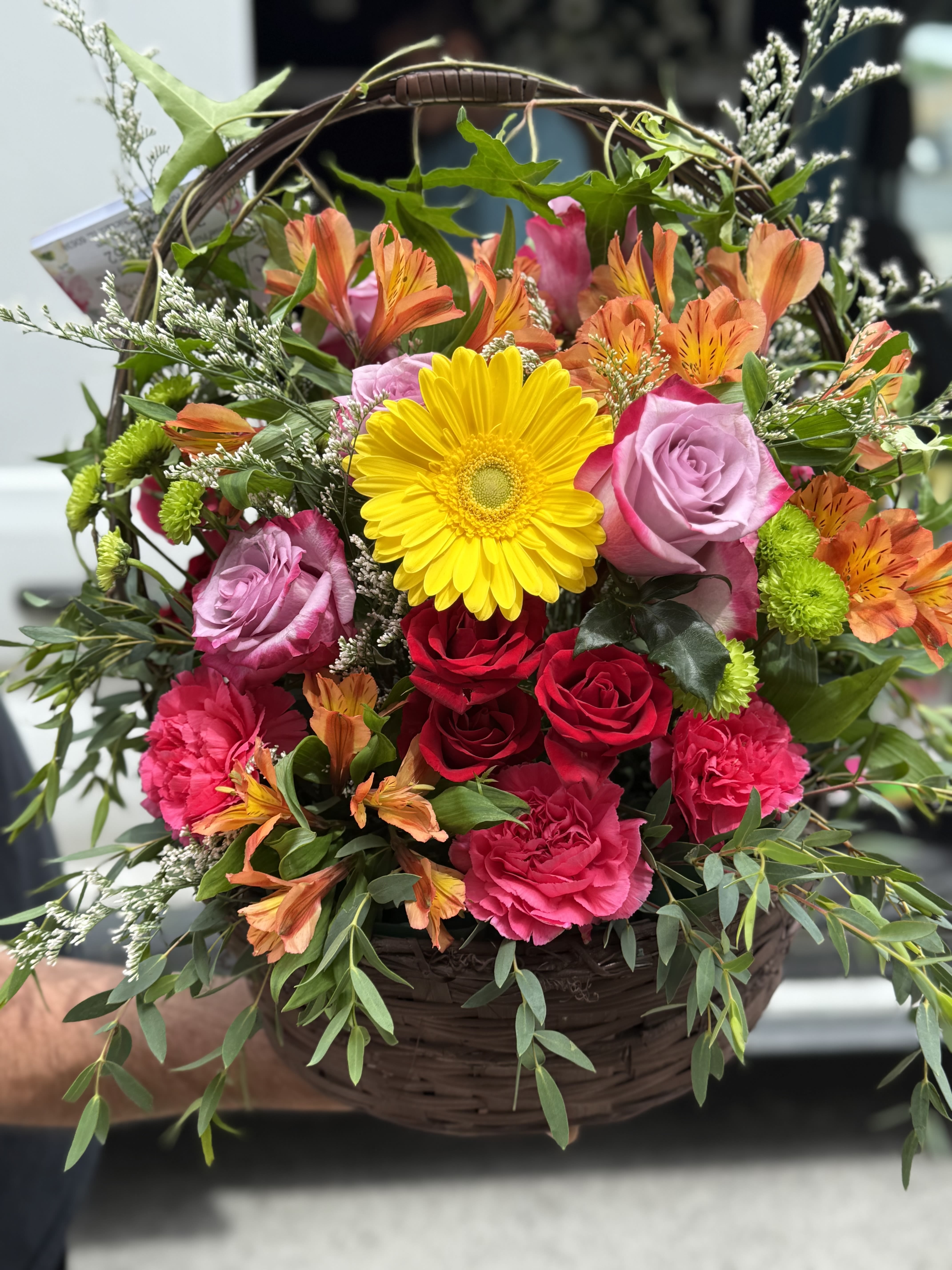 Rosalinda Basket  - Beautiful basket with an assortment of roses and orange alstroemeria. 