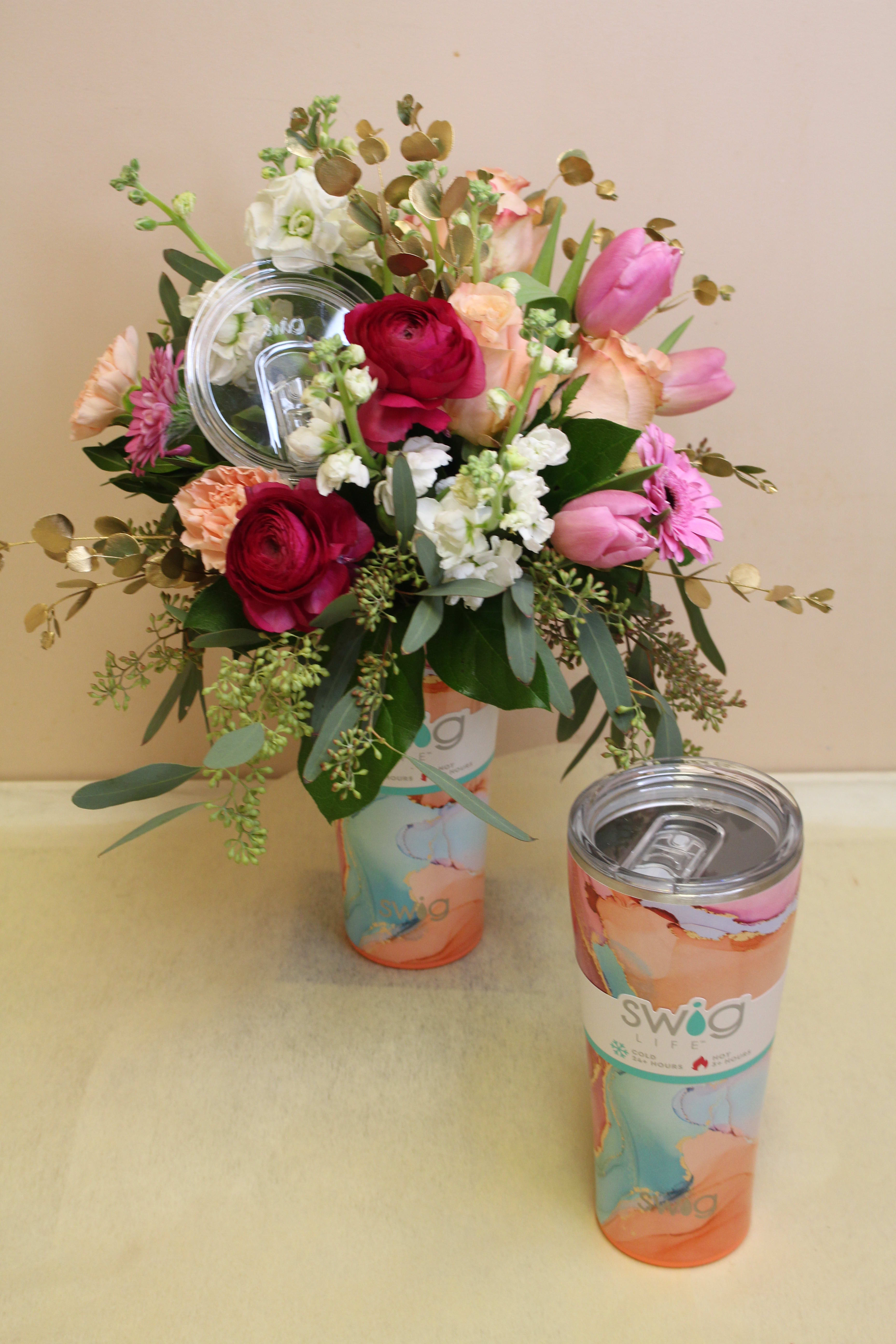 Swig for life Dreamsicle Tumbler - Swig for life tumbler with flower arrangement - awesome gift! Cool off with the chill swirls of dreamy pink, aqua, and orange hues laced with streams of gold.  Our fan favorite 32oz Tumbler features a slim profile, making it cup holder friendly and comfy to hold. The increased capacity means you get to enjoy more of your favorite drinks with fewer refills! Holds up to 32oz Keeps drinks cold 24+ hours and hot 3+ hours Triple insulation technology: double-walled, vacuum-sealed and copper-plated Condensation free and nonbreakable Constructed of 5mm 304-18/8 stainless steel Fits most standard cup holders Slip-free, scratch-free and noise-free silicone base Includes BPA-free, X-Large Lid with removable slider for cleaning Measures: 8.75” H x 4” W (lid included)  Base: 2.8” in diameter  Weighs: 1.0lb when empty  ******************************ONE TUMBLER SOLD PICTURE SHOWS 2 TUMBLERS BUT THE PRICE IS JUST FOR ONE*************************************************