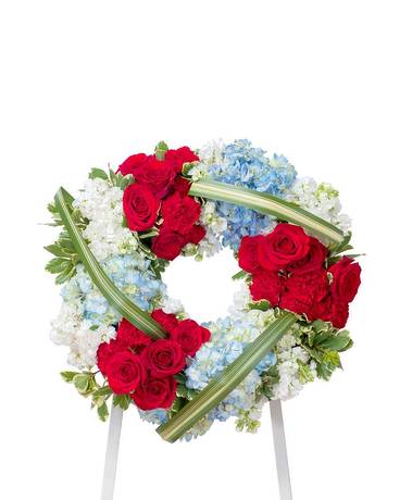 Honor Wreath - This beautiful red, white and blue standing wreath gives tribute to the one who served with honor. 