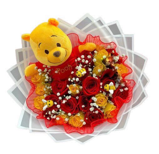 Winnie the Pooh Bouquet - 25 rose bouquet includes 25 red and yellow roses, babies breath, Winnie the Pooh Plush, mini bumble bees plush, wrapped in Red paper. 
