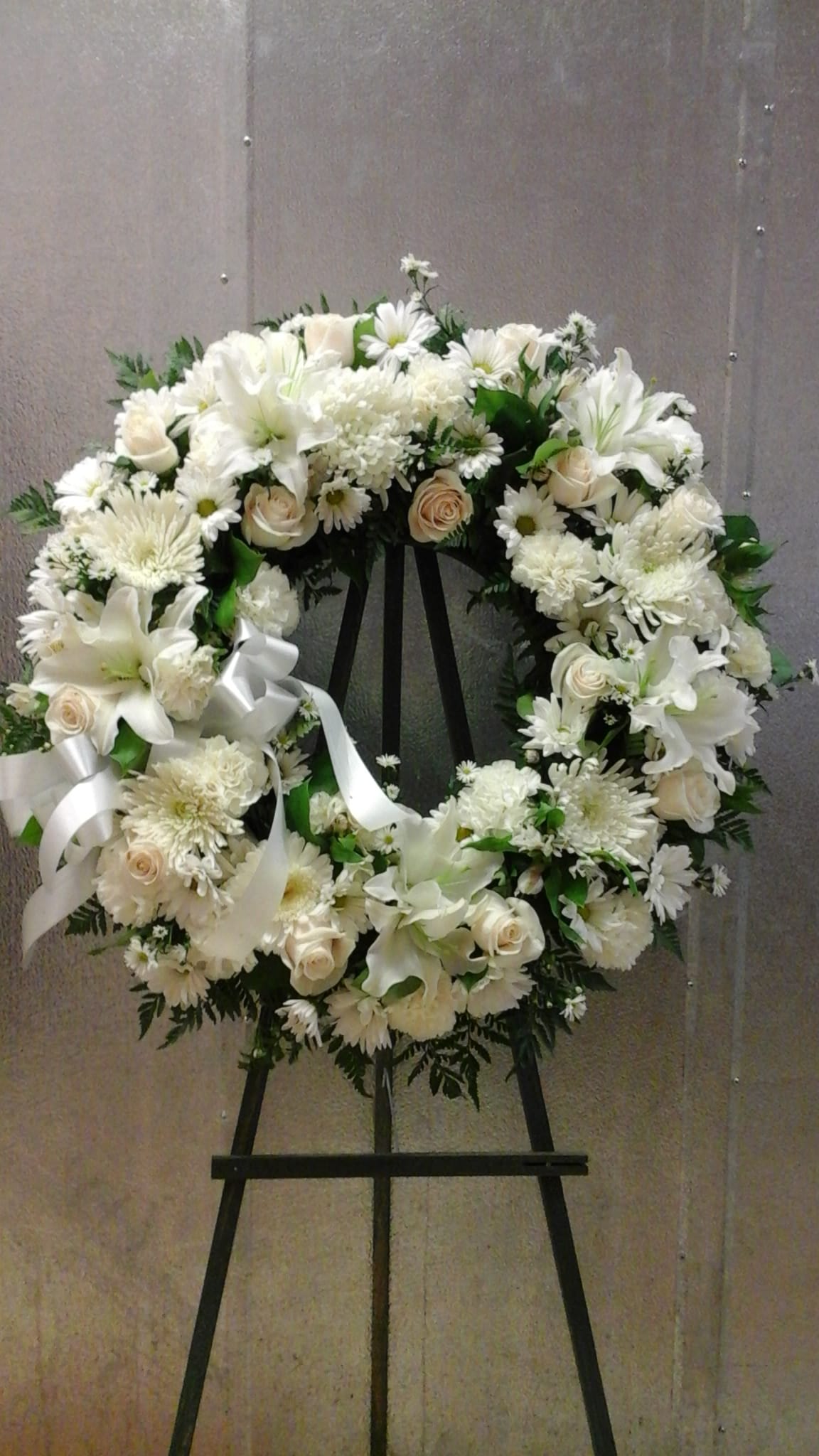 All white standing wreath (FW3) All white standing wreath (FW3) - This wreath make with all white color flowers, roses, carnations , mum and lilies