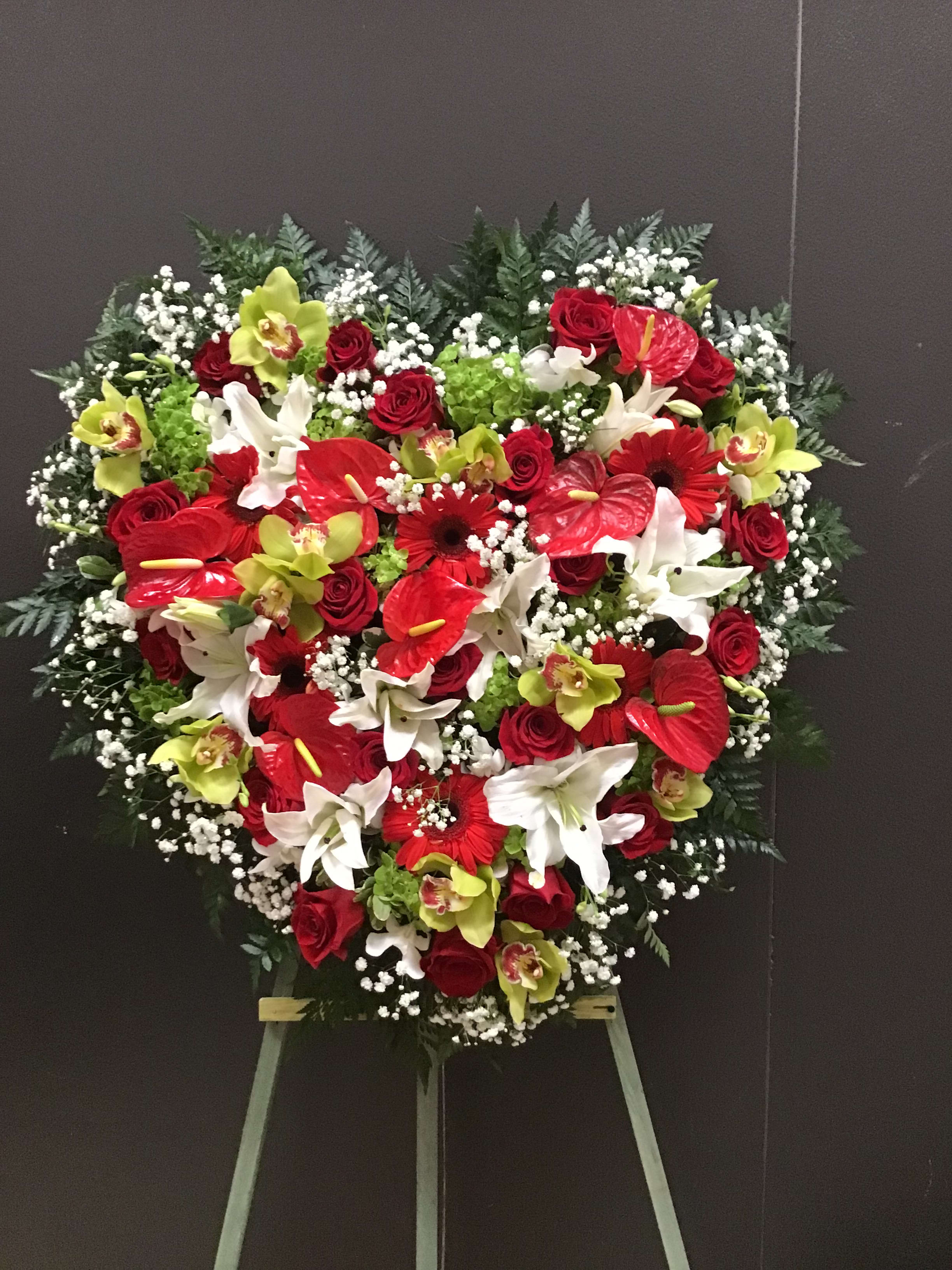 Beauty and Elegant Solid Heart Beauty and Elegant Solid Heart - The solid heart made it with all the beautiful and elegant blooms like cymbidium orchid, Anthurium, Hydrangea, lilies roses and gerbera daisy .