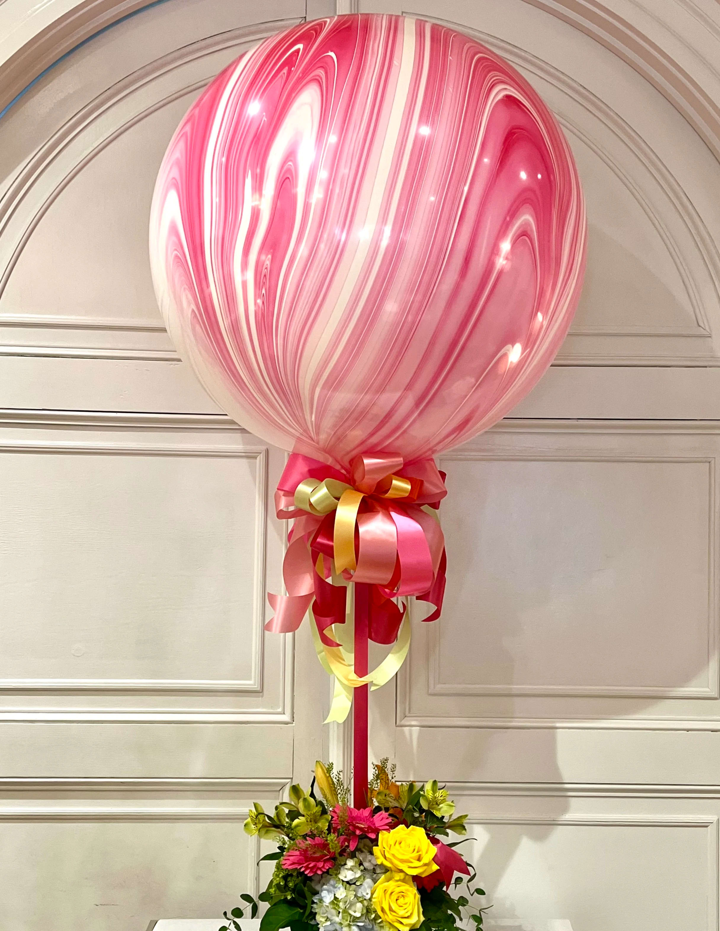 &quot;Now It's a Party!&quot; Balloon and Flower Bouquet - This show-stopping display is sure to make anyone who sees it 'Ohh and Ahh!'  Our colorful swirled helium balloon is attached to an arrangement of seasonal flowers. The balloon is a whopping 30&quot; across! We can customize floral and ribbon colors to suit your taste. The balloon comes in a myriad of colors. Pink Swirl (Pictured), Red Swirl, Blue Swirl, Green Swirl, Purple Swirl, and Multi Swirl. Let us know what colors you would like to see in the special instructions and and we'll do our best to accommodate. Expect variations in balloon pattern and exact coloration. Please allow 24 hour notice. 