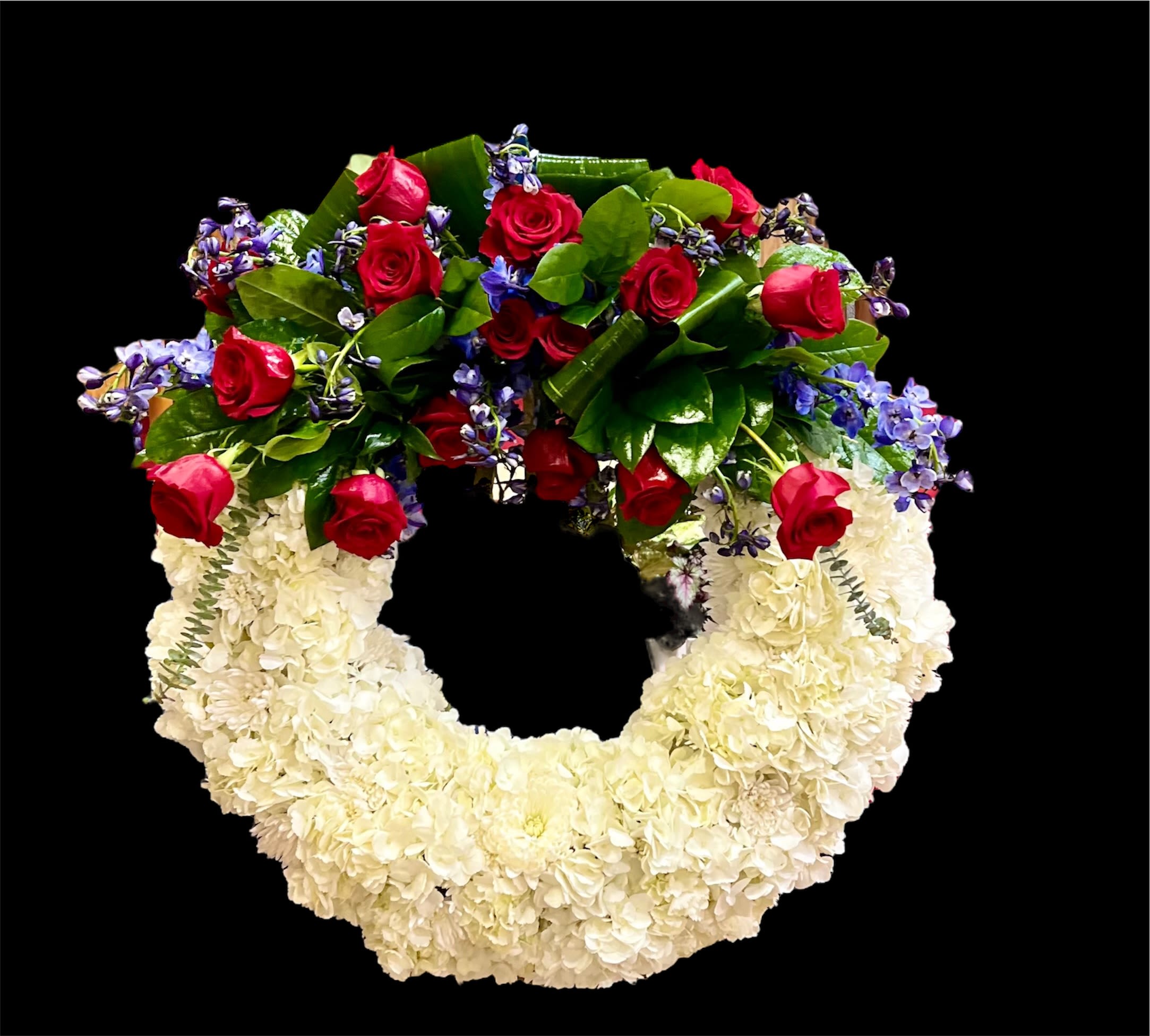 American Soul  - A perfect way to honor their beliefs and actions, this red, white, and blue wreath is a tribute to those who loved their country. 