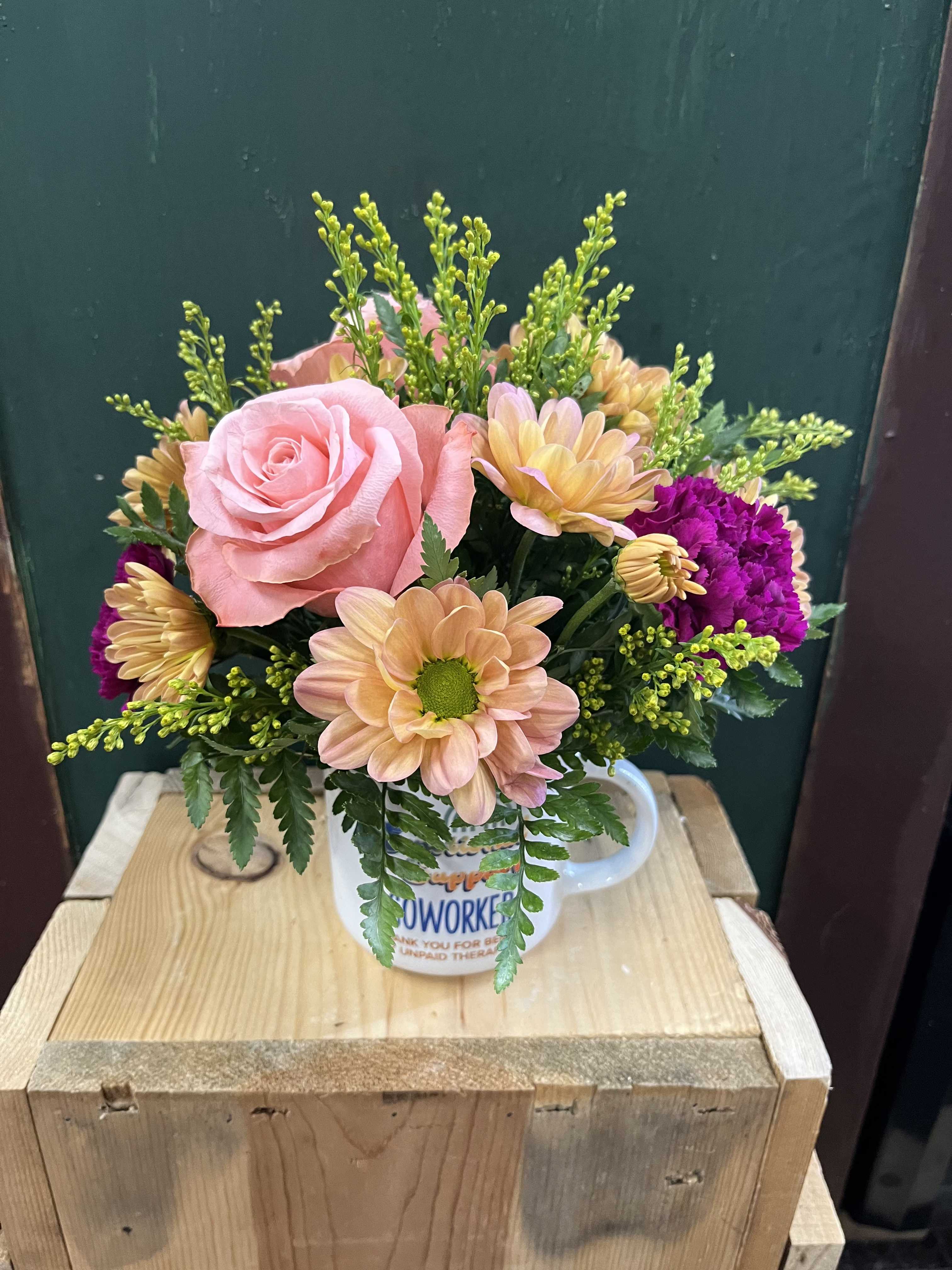 Caring Coworker Bouquet  - Need a little something for your favorite coworker?  This arrangement is made for you! It features daisies, carnations, and roses in an amazing coworker mug. 
