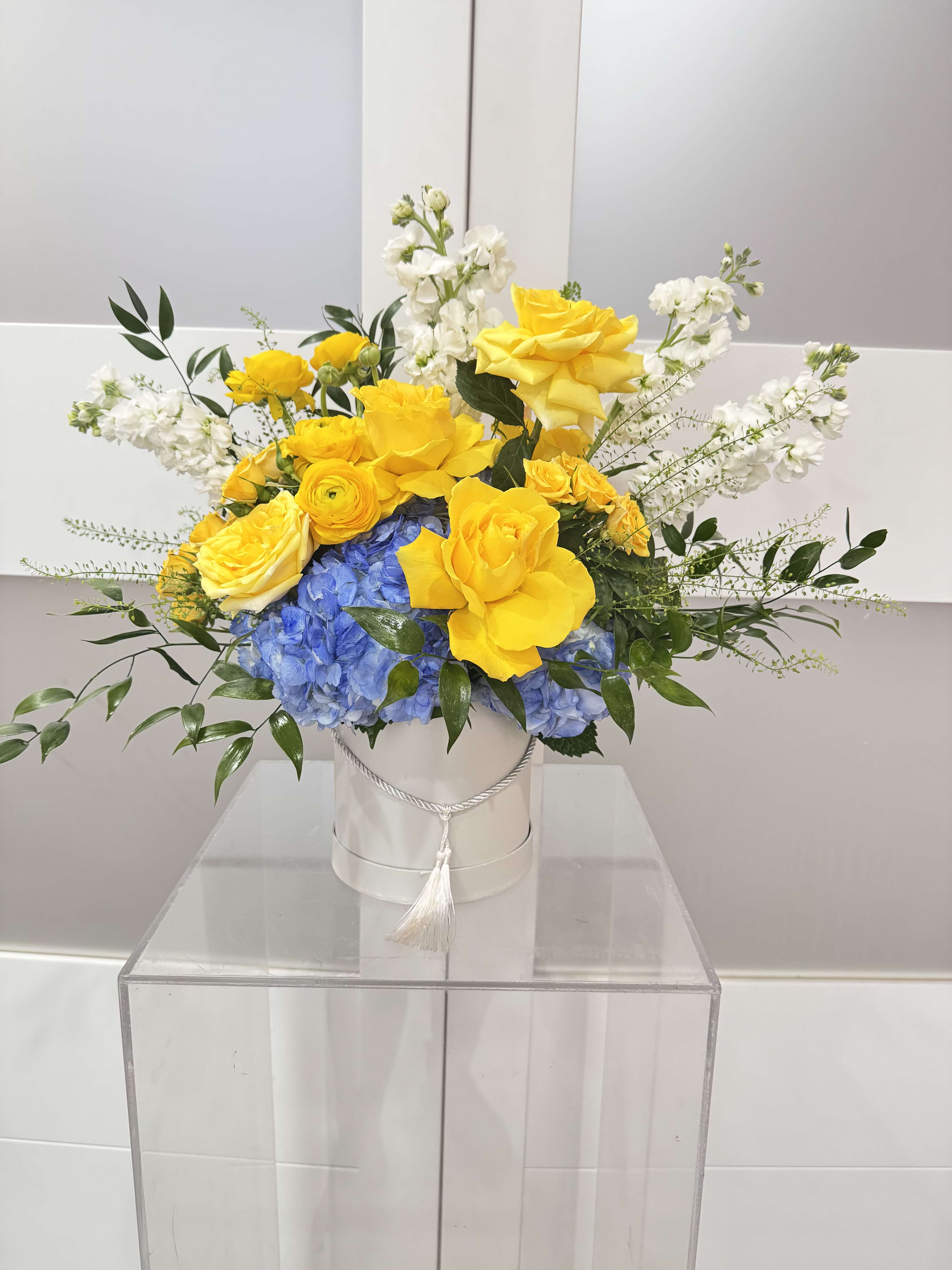 Amalfi Coast - Bringing inspiration from the bright colors of the Amalfi Coast we created a lush and luxurious composition of assorted premium roses, ranunculus, stock, and hydrangeas in a box.   This arrangement is not only ultra chic but will brighten anyones day.