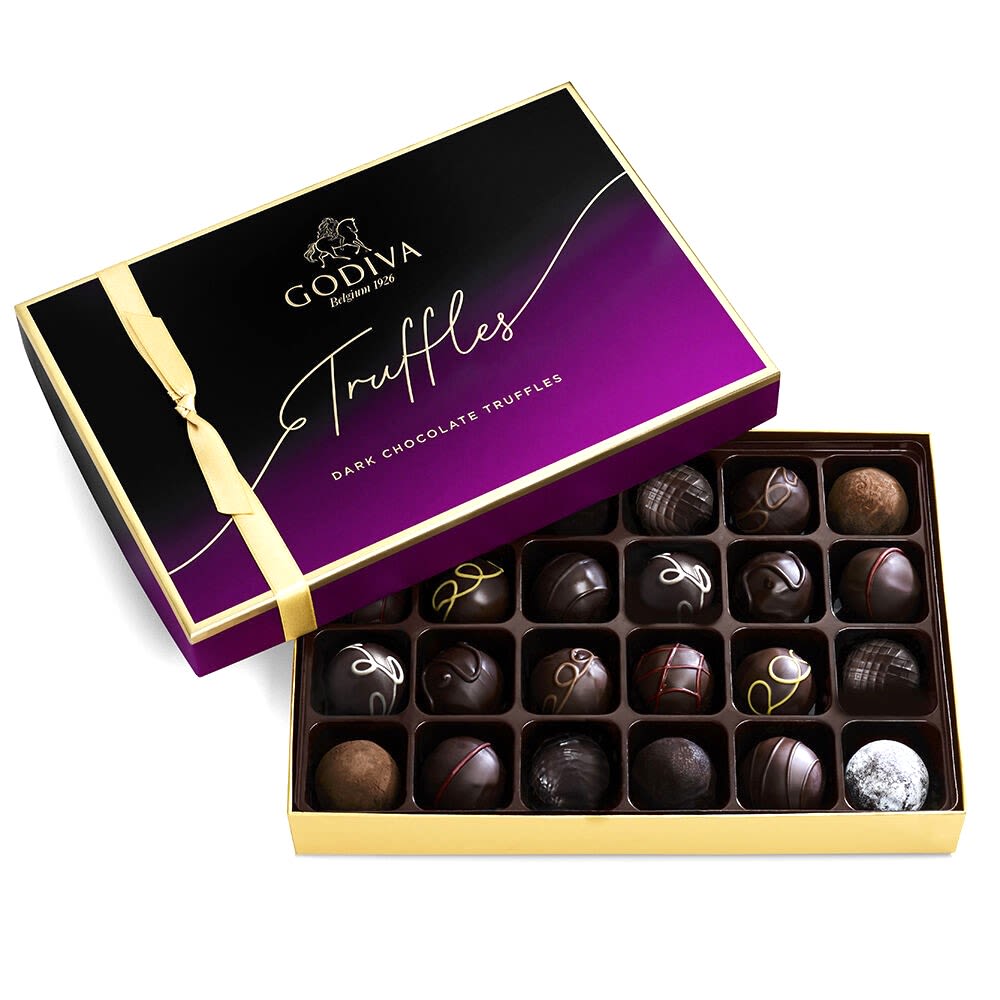 Godiva Dark Chocolate Truffle Assortment (24pc) - Godiva Dark Chocolate Truffle Assortment (24pc)  Indulge in the exquisite taste of Godiva's Dark Chocolate Truffle Assortment. This luxurious collection features twenty-four pieces of rich, decadent dark chocolate truffles, each crafted to perfection.  Key Features:  Premium Quality: Made with the finest ingredients, Godiva's dark chocolate truffles are known for their smooth texture and exceptional flavor. Assorted Flavors: Includes a variety of Godiva’s most popular dark chocolate truffles, offering a delightful and diverse tasting experience. Elegant Presentation: Beautifully crafted and elegantly packaged, perfect for gifting or enjoying as a special treat. Perfect for Any Occasion: Ideal for birthdays, anniversaries, holidays, or simply to indulge your chocolate cravings. Twenty-Four Pieces: Ensures a satisfying and memorable chocolate experience.  Treat yourself or someone special to the luxurious taste of Godiva's Dark Chocolate Truffle Assortment. Each truffle reflects Godiva's dedication to quality and craftsmanship, providing an unforgettable indulgence.  