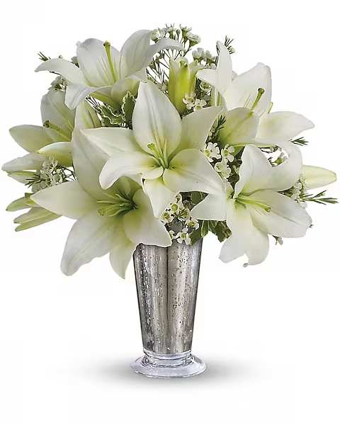 Written in the Stars by Teleflora - This classic silver and white arrangement is a stunning way to let that special someone know how you feel. Inspired by a romantic night sky, it's a dazzling way to pay homage to your years together.  Elegant white lilies and pretty white waxflower stems are exquisitely arranged in a silver Mercury Glass Antique vase that's reminiscent of a star-filled sky. It really is a wish come true.