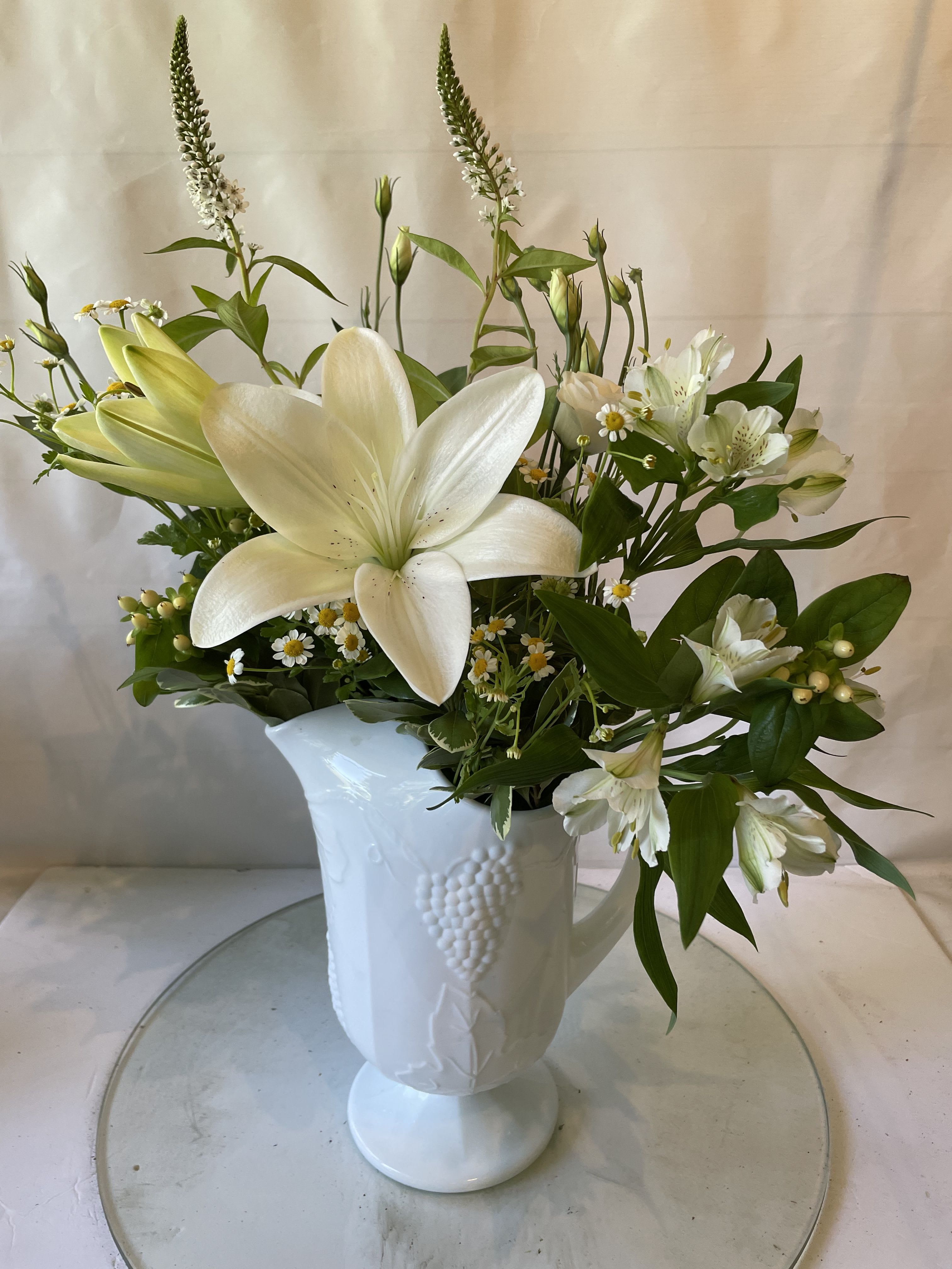 Lovely white pitcher - White keepsake pitcher filled with beautiful white flowers. Great for any occasion.