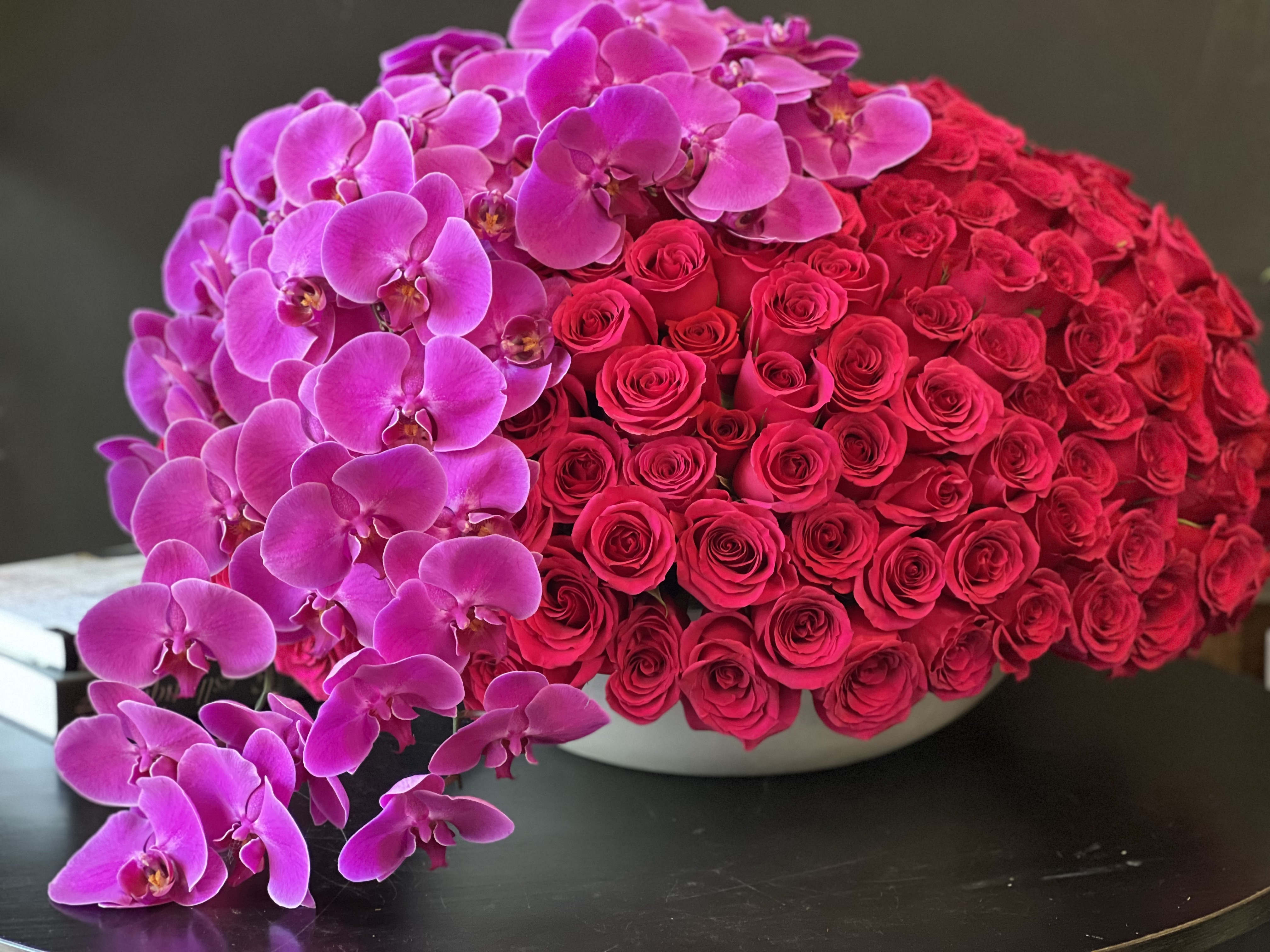 300 hot pink roses and orchids - 300 hot pink roses and orchids arrangement in ceramic vase  