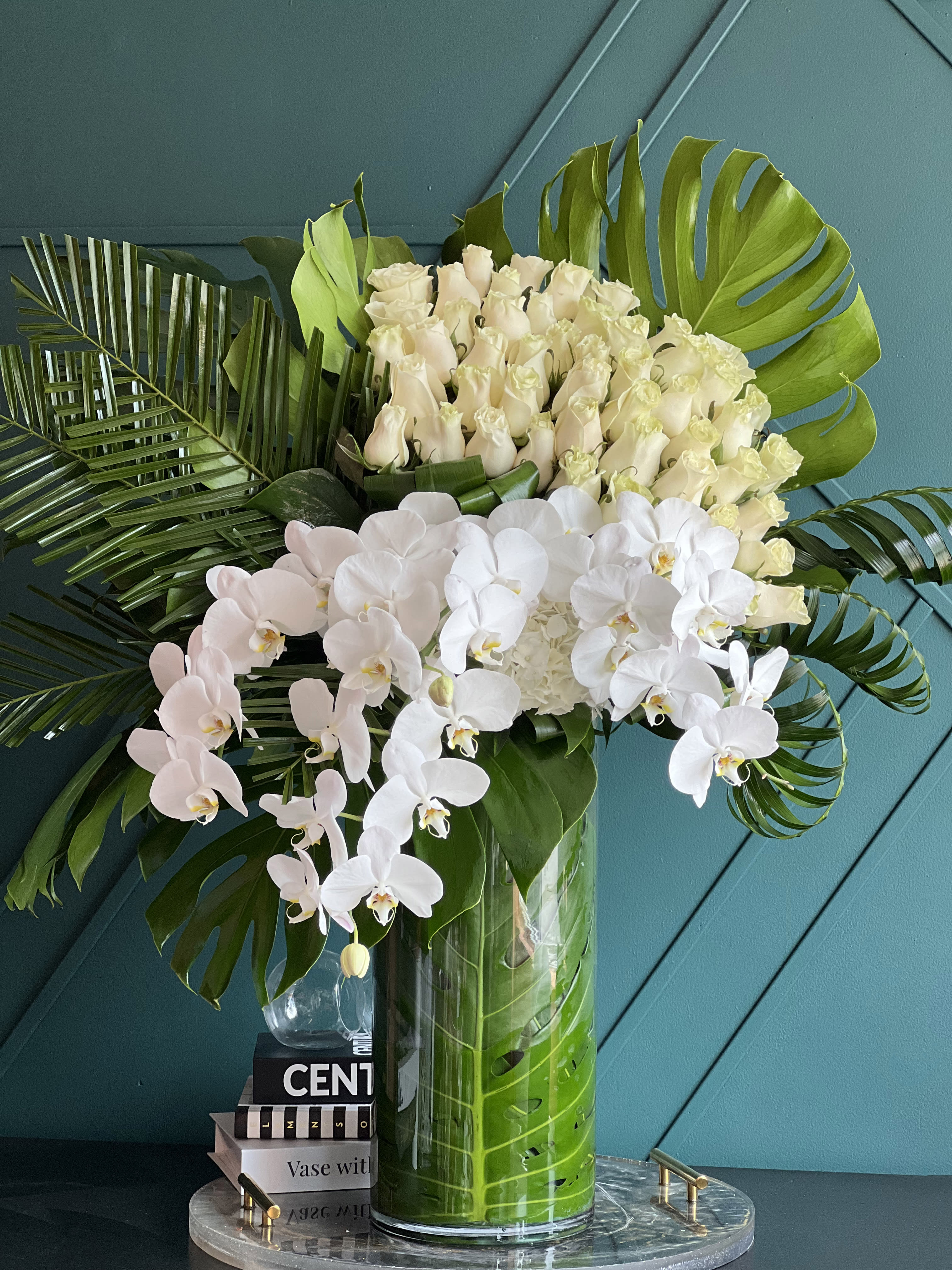 Tall modern design with roses and orchids  - Tall modern design with roses and orchids   Perfect combination of white roses ( 50 stems), phalaenopsis orchids, white hydrangeas and greenery arranged in tall vase  