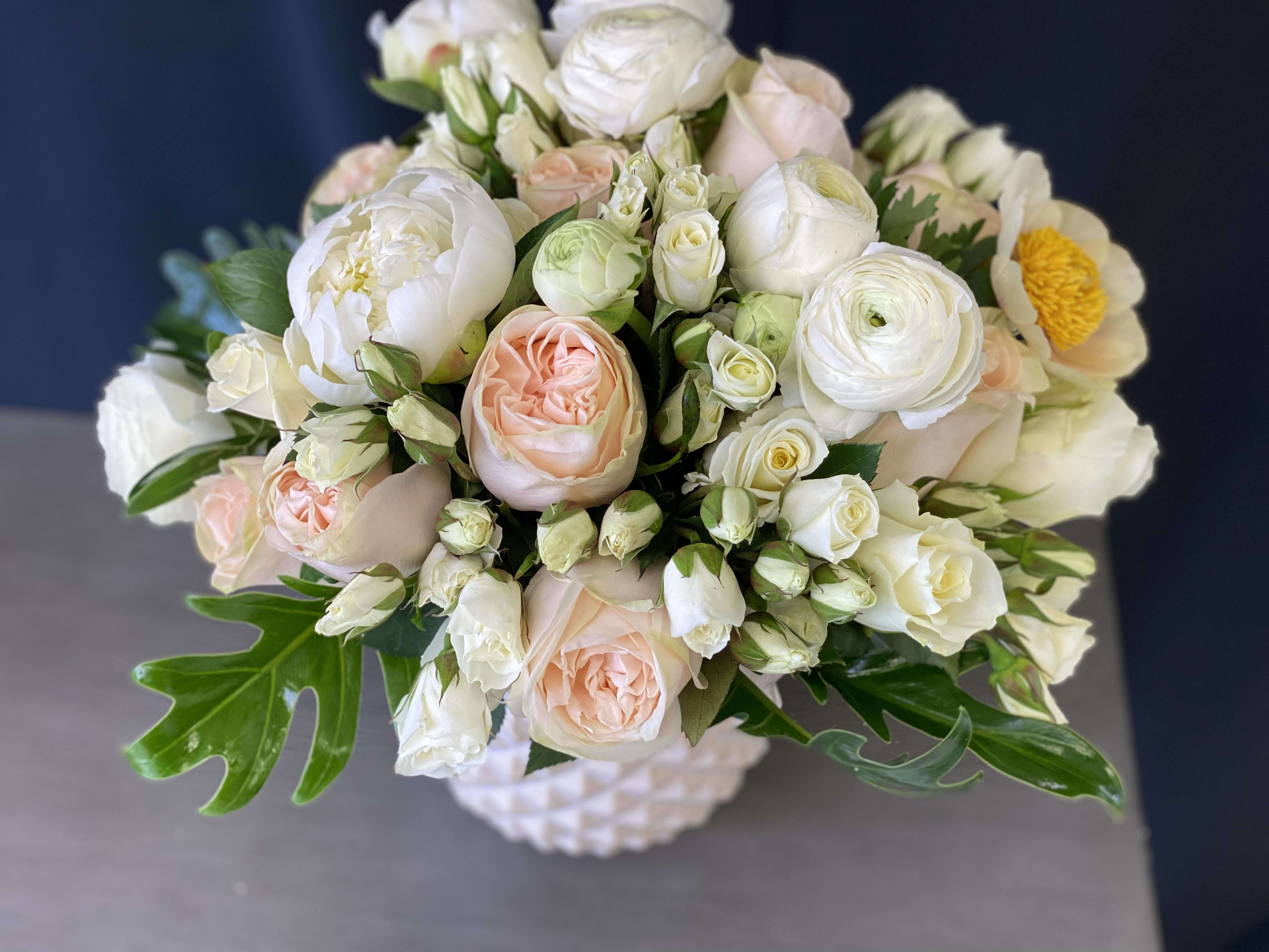 Mixed spring arrangement - Mixed arrangement with ranunculus, spray roses, roses, peonies and greenery 