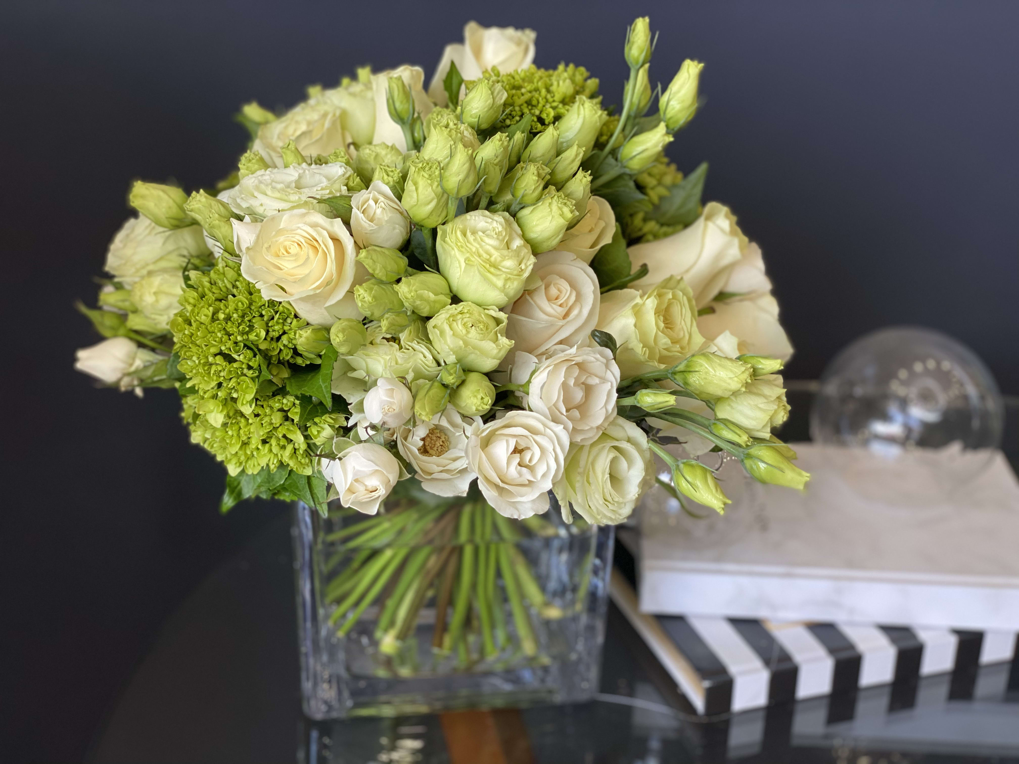 White and Green Floral Design in cube vase  - Perfect mix of white roses, spray roses, green hydrangeas and lisianthus 
