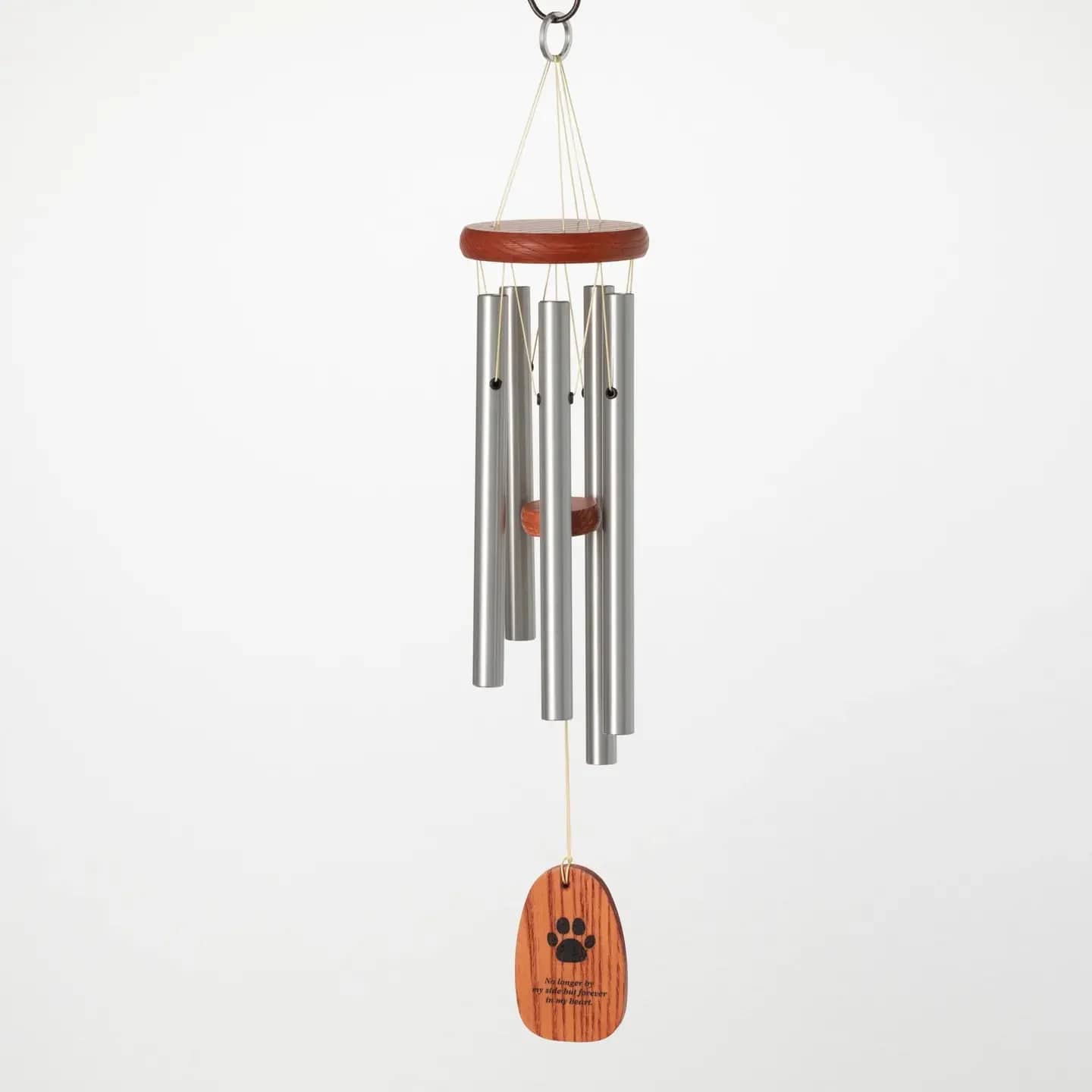 Woodstock Chimes Forever In My Heart Pet Sympathy Windchime Woodstock Chimes Forever In My Heart Pet Sympathy Windchime - This chime is a touching tribute to a precious pet, tuned to a beautiful pentatonic scale. The enchanting, peaceful tone is a wonderful way to celebrate the special relationship you had with your fur baby. The clapper features a paw print and the message "No longer by my side, but forever in my heart." 20" long