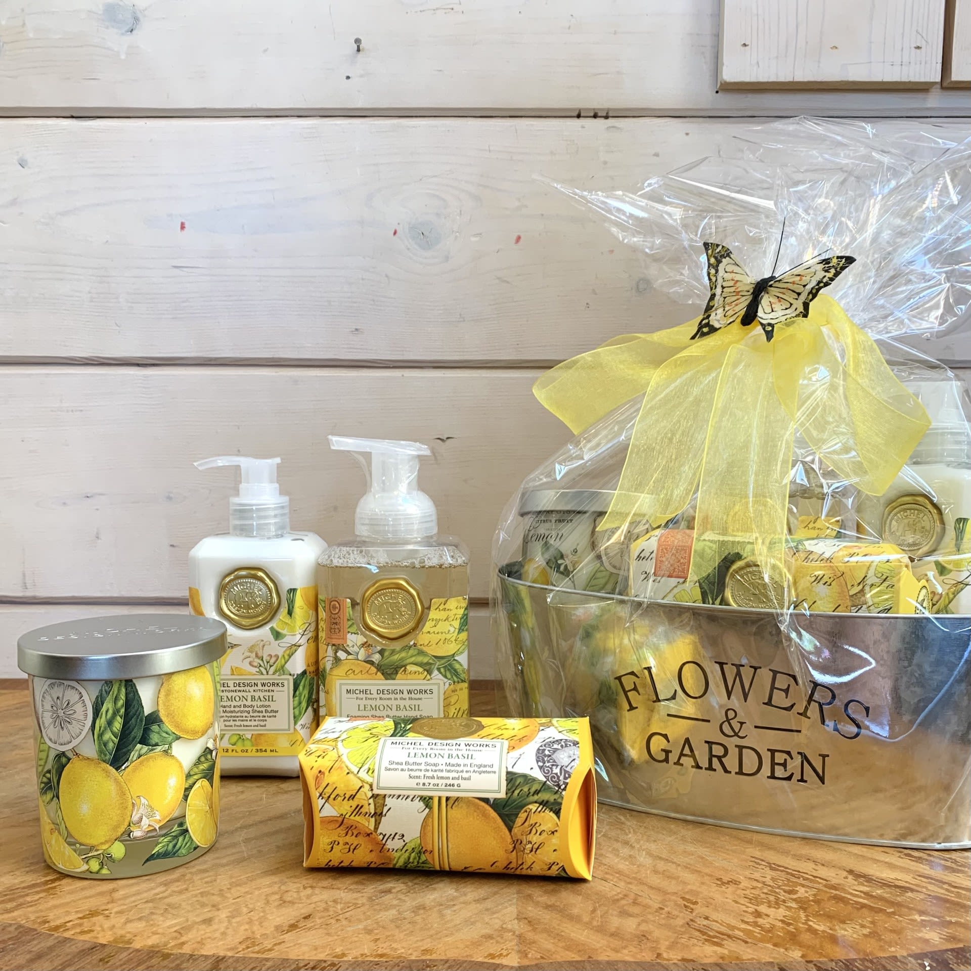 Lemon Basil Deluxe Gift Basket  - This large gift basket includes one hand and body lotion, one scented travel candle, one foaming hand soap, and one large bar soap. Beautifully wrapped up and ready to go with a large bow and sweet butterfly accent.    Items included: 1) Our hand and body lotion is made with shea butter, aloe, and other botanical ingredients. The decorative bottle of luxurious lotion is packaged in a beautiful keepsake gift box.  8 fl. oz. / 236 ml lotion.  2) Our all-natural, 100% soy wax travel candle is nontoxic, biodegradable and clean burning. The handy, decorative, and versatile tin can be used at home or when traveling, indoors or out.  4 oz./113.4 g. Over 20 hrs. approximate burn time.  3) The generous size of our foaming hand soap proves you can offer great value without sacrificing quality. Plus it contains luxurious shea butter and aloe vera for gentle cleansing and moisturizing.  17.8 fl. oz. / 530 ml liquid  4) Our triple-milled soap is silky smooth and long lasting, and contains the finest pure palm oil, glycerin, and rich shea butter. Made in England.  8.7 oz. / 246 g Size: 4.4 x 2.75 x 2'' / 11.1 x 7 x 5.1 cm  Fragrance: Citrus notes of lemon and mandarin enhanced with green basil leaf.  Customizable gift baskets available upon request. Please give us a call at 775-348-6161 for assistance putting together the perfect aromatherapy basket for your loved one. 