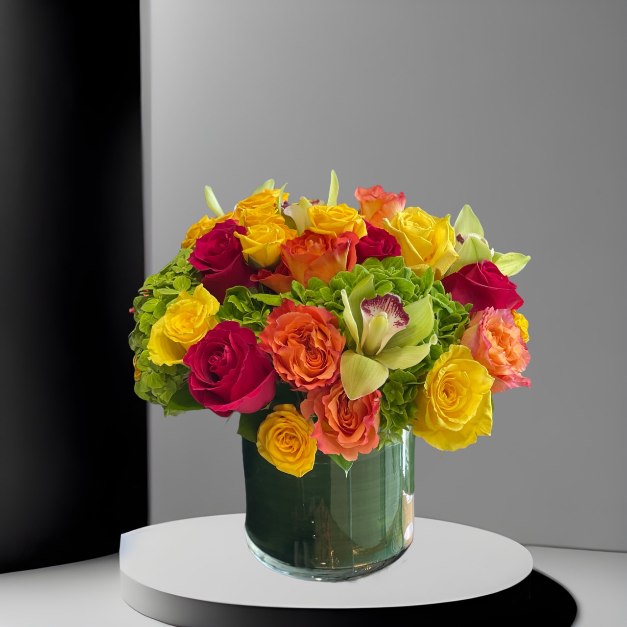Bright Abundance - LFD - This cylindrical vase of flowers is kind of like a time capsule, if time were made of flowers. What a wonderful “time” that would be. In the season of changing plants, leaves, and flowers, this cylinder of bright abundance reminds us of the beauty that comes with the changing of the seasons. Spoiler alert: that’s a lot of beauty.  