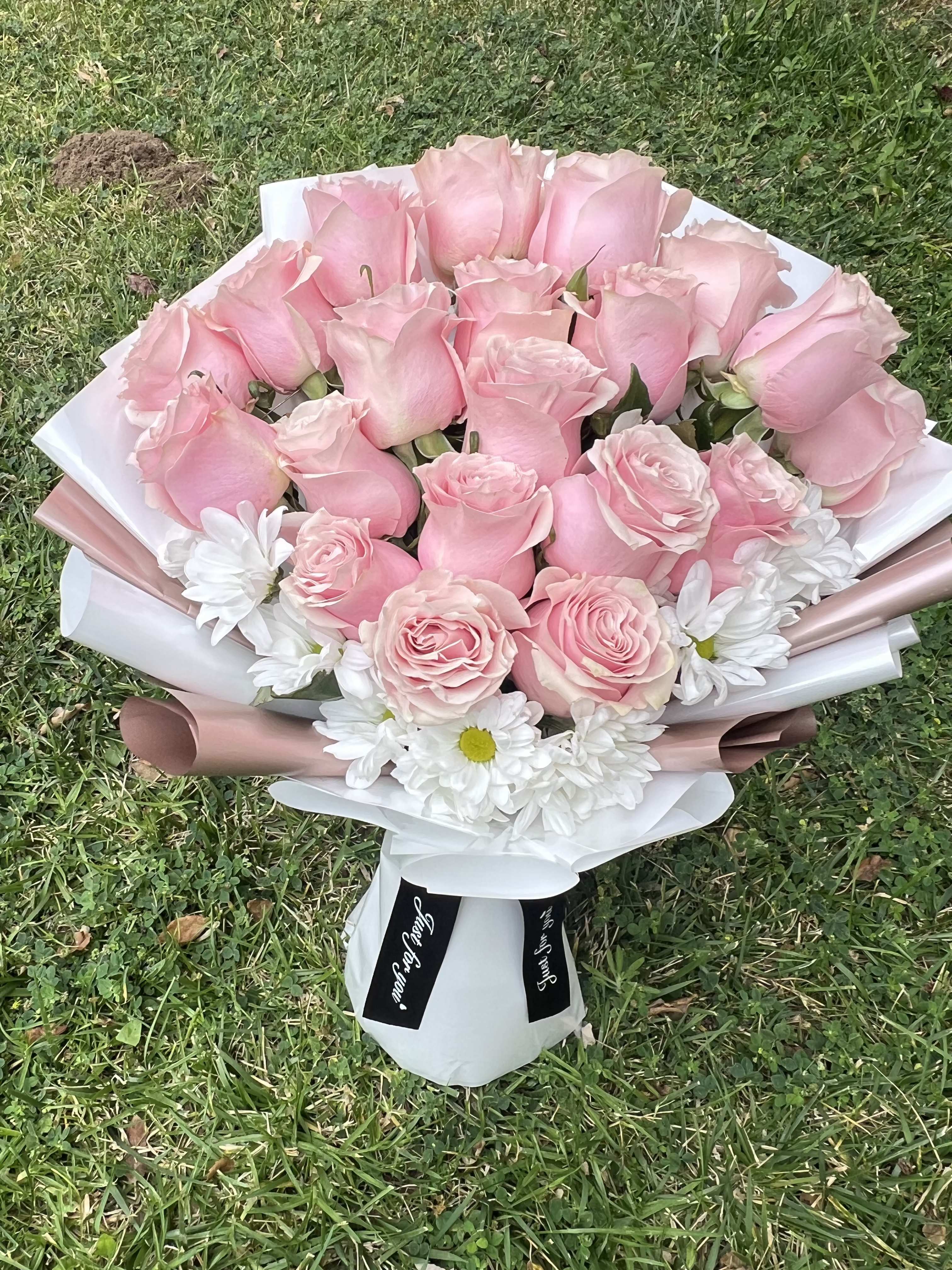 Pink Perfection - Soft, sweet, and timeless, Pink Perfection features elegant light pink roses paired with fresh white daisies, wrapped in chic rose-gold and white designer paper. This bouquet is a beautiful choice for birthdays, anniversaries, baby showers, or just because. 