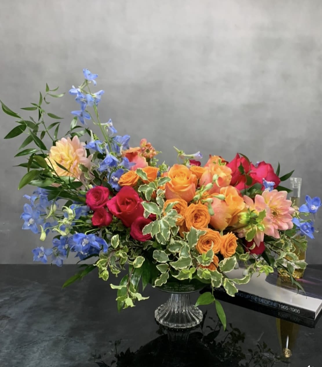 Mix summer  - Full of mix colors arrangement , is sitting in a pedestal Cristal  vase  6 inch tall, is elegant , to have a fancy dinner for any ocasión take a chance don’t miss this precious  piece,..