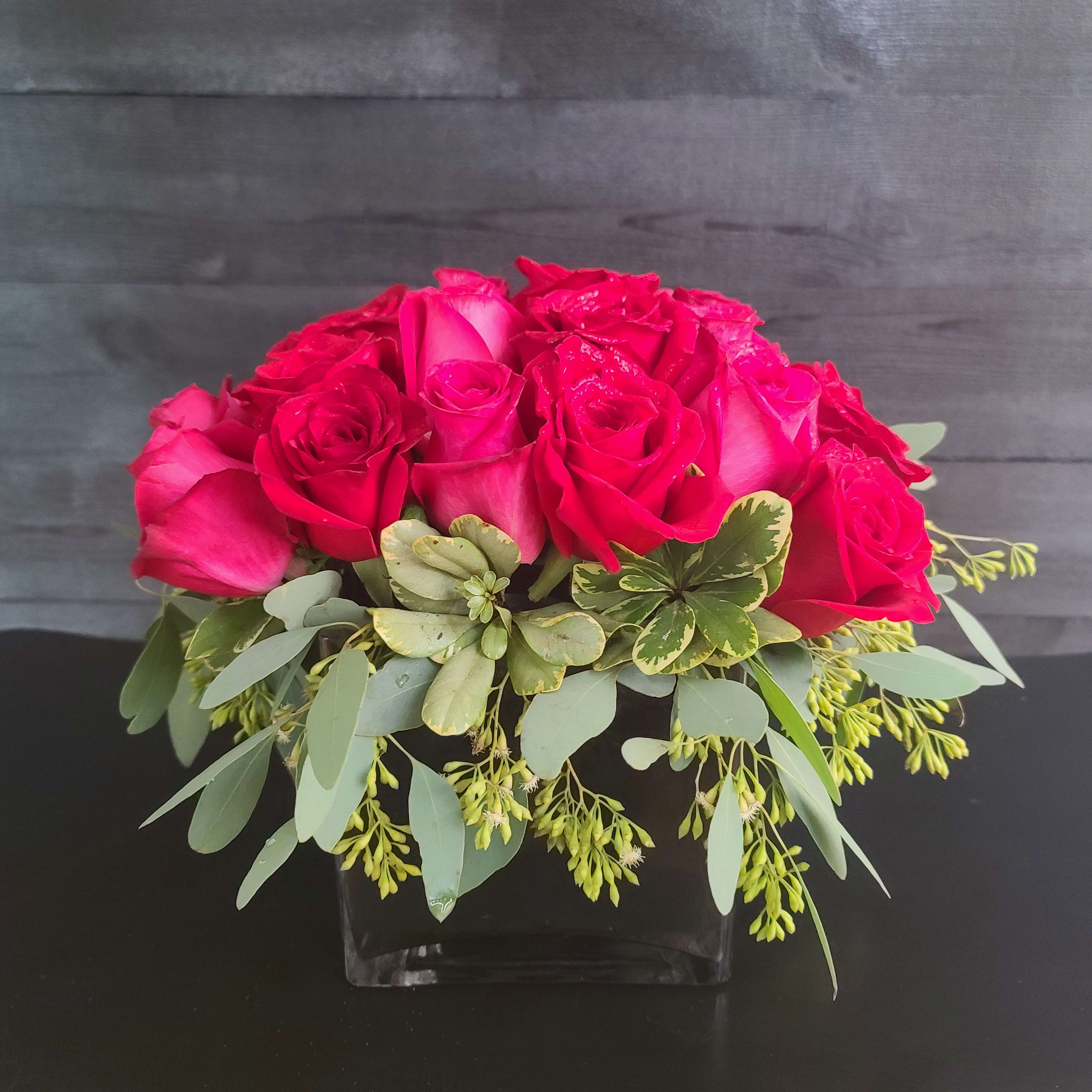 2 Dozen Blooms For You - For that low and classy look, this is the way to go.  2 dozen roses on a bed of eucalyptus. This scent mix is amazing. 