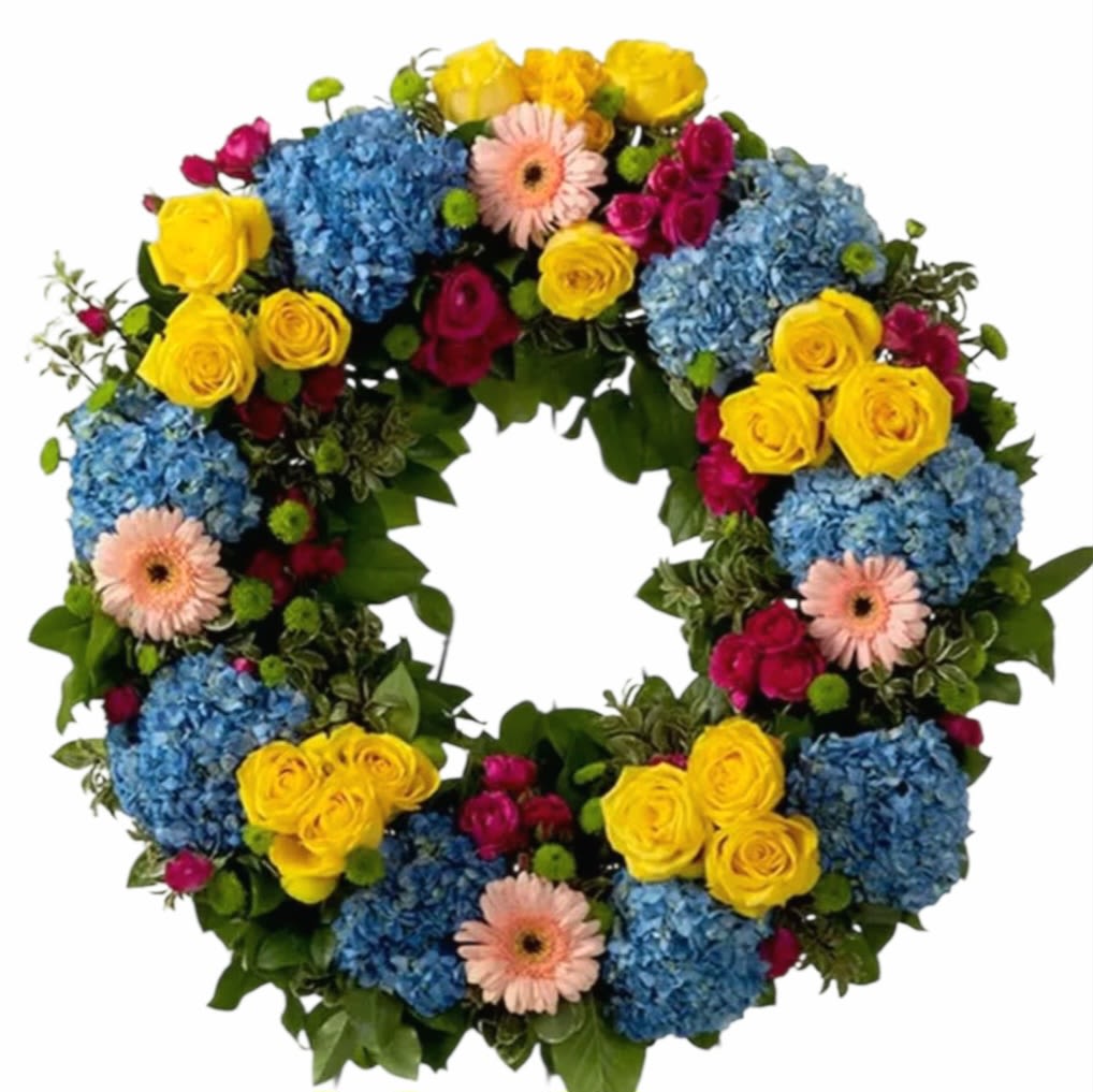 Vivid Spring Vivid Spring - This colorful and bright wreath spray is representative of a life lived to its fullest. Colors and Flowers may change based off of season and availability.