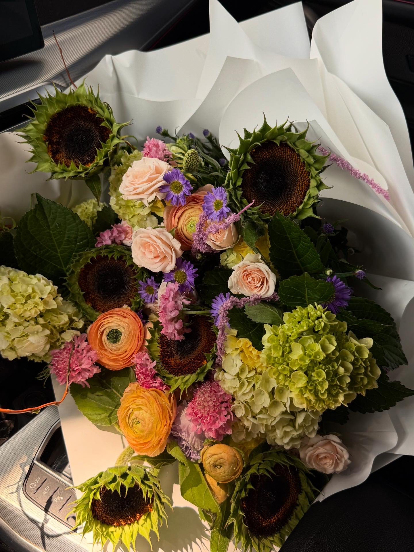 Chocolate Sunflower Chocolate Sunflower - Stunning bouquet full of Sunflowers, Ranunculus, and other mixed flowers