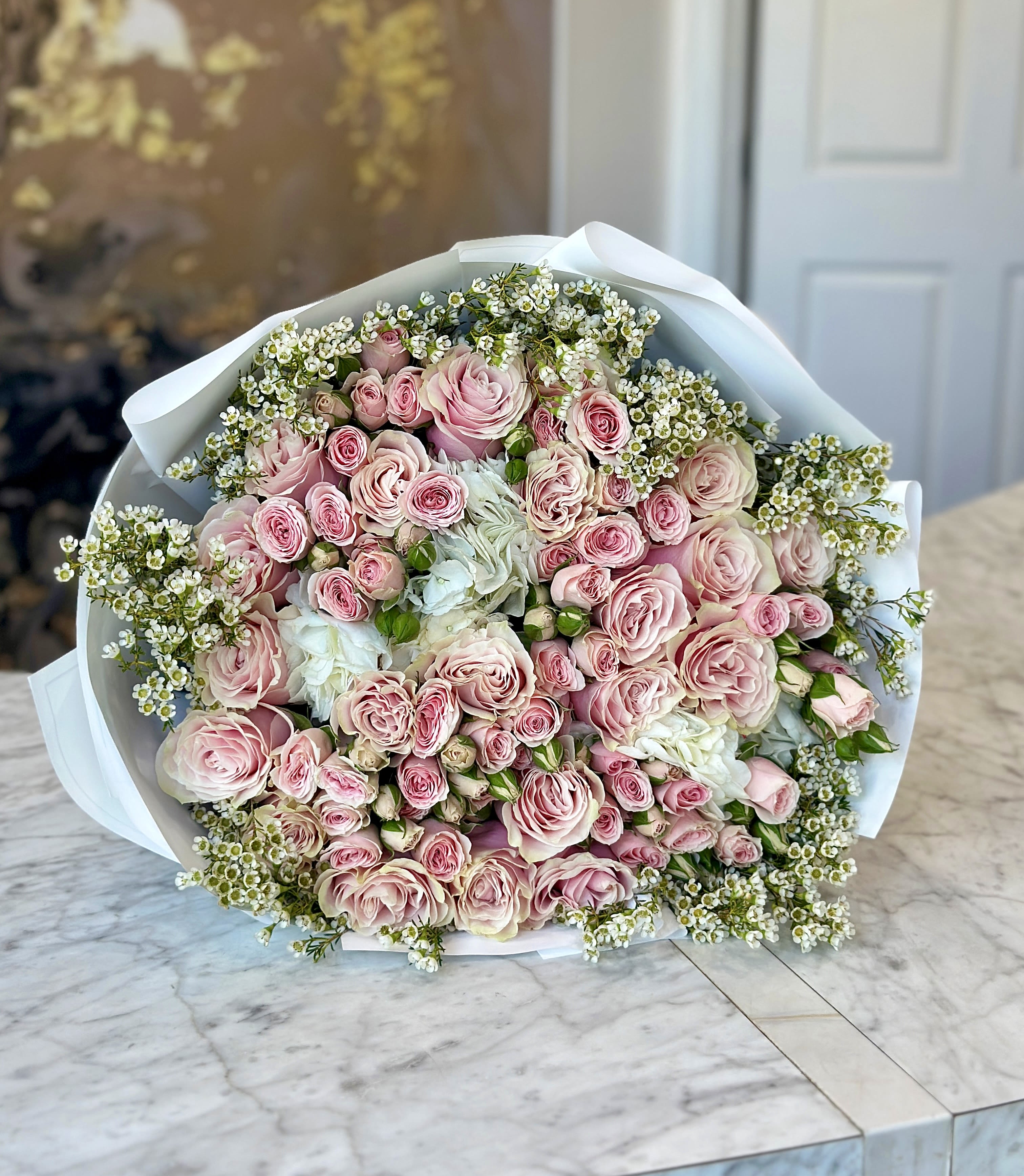 Blush - Brighten any space with our Elegant Flower Bouquet! Bursting with vibrant blooms, this stunning arrangement features seasonal favorites paired with lush greenery for a breathtaking display.  Perfect for any occasion, it makes an ideal gift or a special treat for yourself. Elevate your decor with this captivating bouquet that brings joy and sophistication to your home or office.  Order yours today and let the beauty of flowers inspire you!