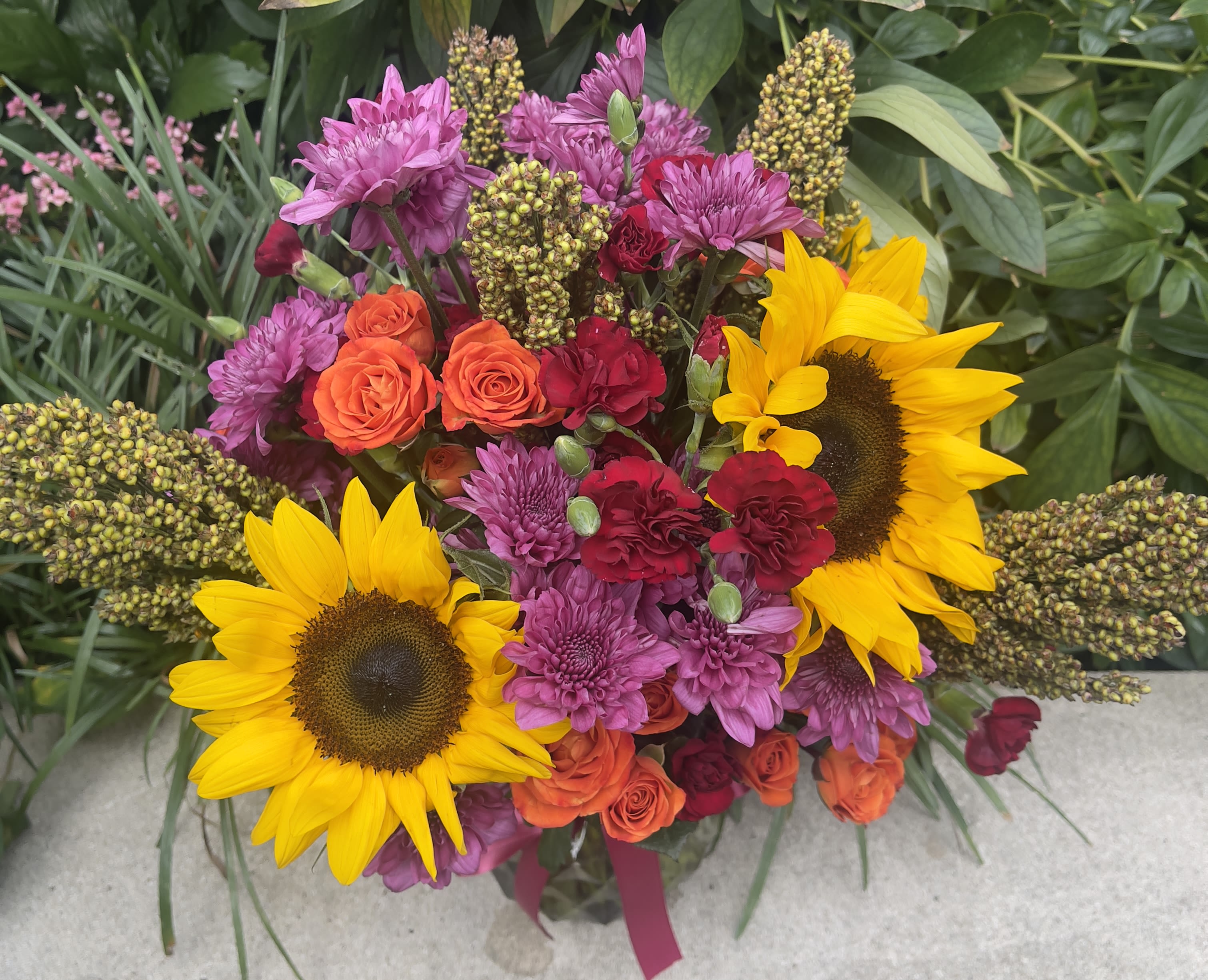 Summer Soiree - Summer Soiree featuring the sunflower mixed with roses, carnations and daisies