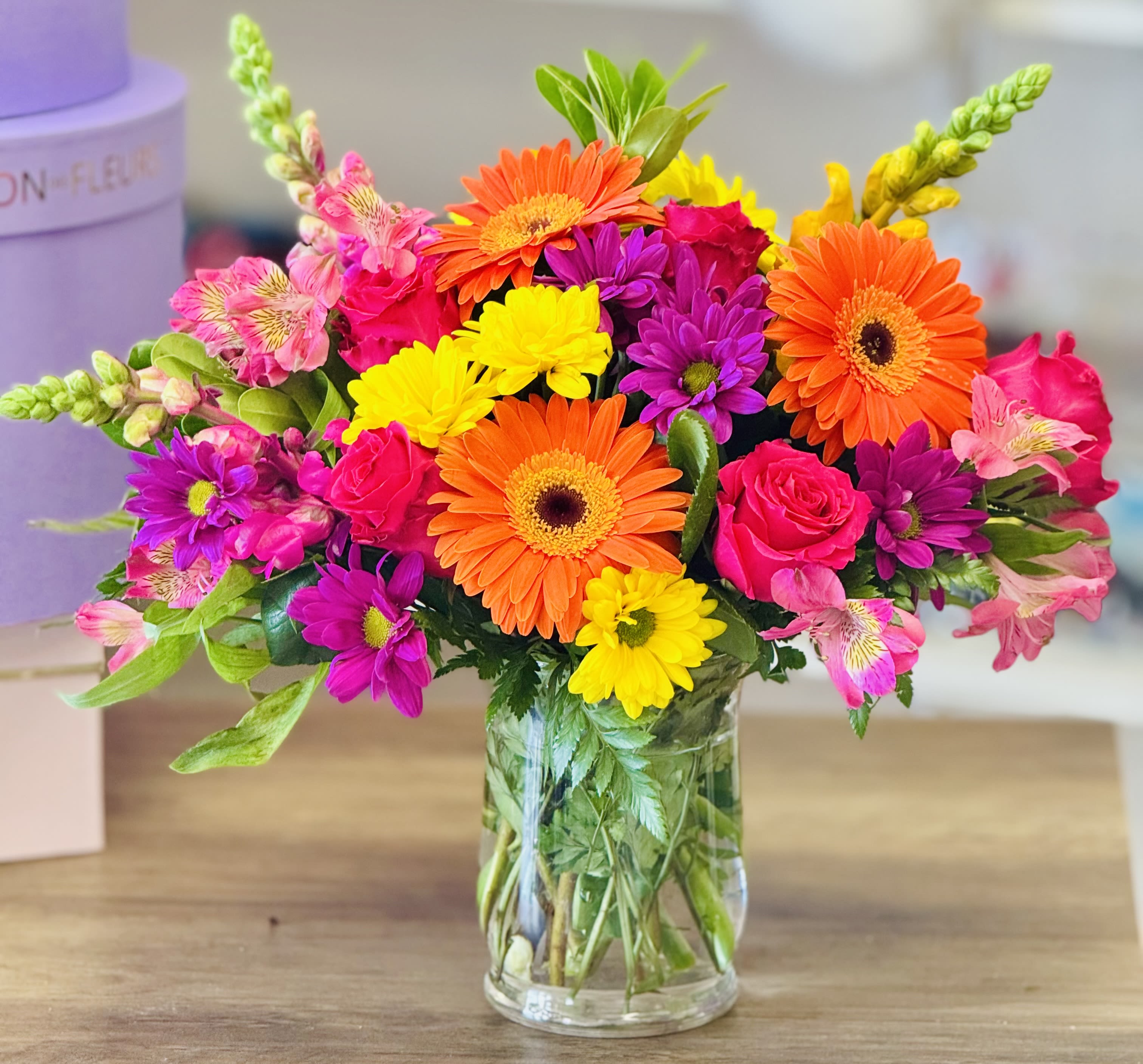 Splendid Surprise Splendid Surprise - A beautiful combination of colorful florals arranged in a cylinder vase. Arranged for that special someone that you would love to surprise or bright their day!