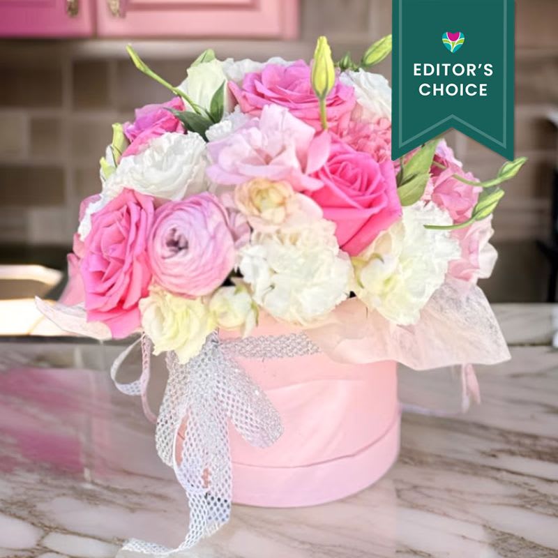 Flower in a Box &quot;Pink Delight&quot; - Editor's Choice - This luxurious floral arrangement combines delicate pink roses, pristine white blooms, and fresh greenery, artfully arranged in a pastel pink hatbox. Ideal for celebrating birthdays, anniversaries, or simply brightening someone’s day, this bouquet adds a touch of romance and sophistication to any occasion. Perfect for delivery to homes, offices, or venues across Los Angeles, including Beverly Hills, Santa Monica, and Downtown LA. Whether it's a surprise gift or a centerpiece for a special event, this hatbox bouquet offers elegance and charm. Same-day delivery is available in Los Angeles and surrounding areas.