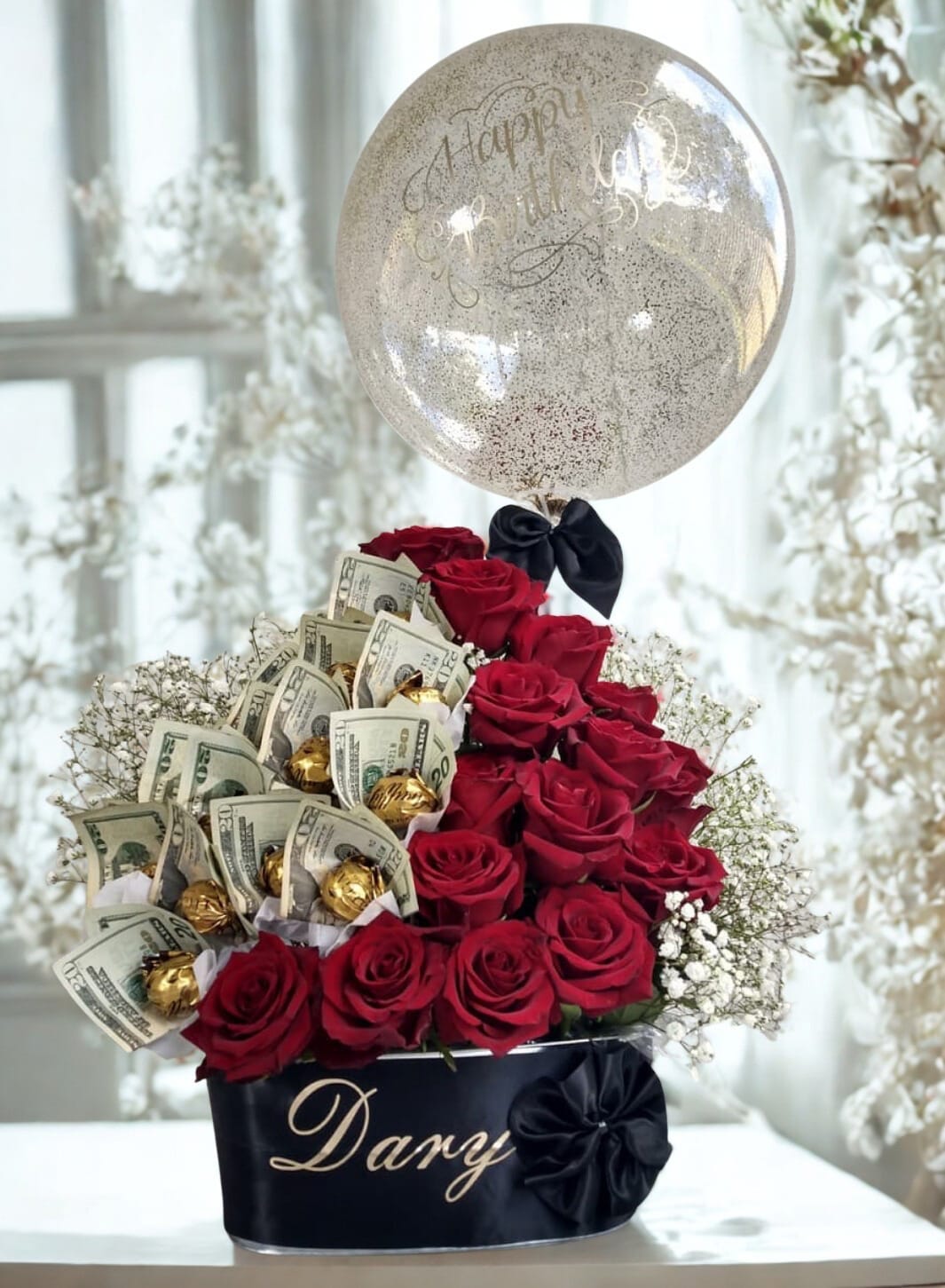 Dary Dary - Arrangement of red roses, Ferrero Rocher, with a bubble balloon and a personalized box. (The money is not included in the quote)