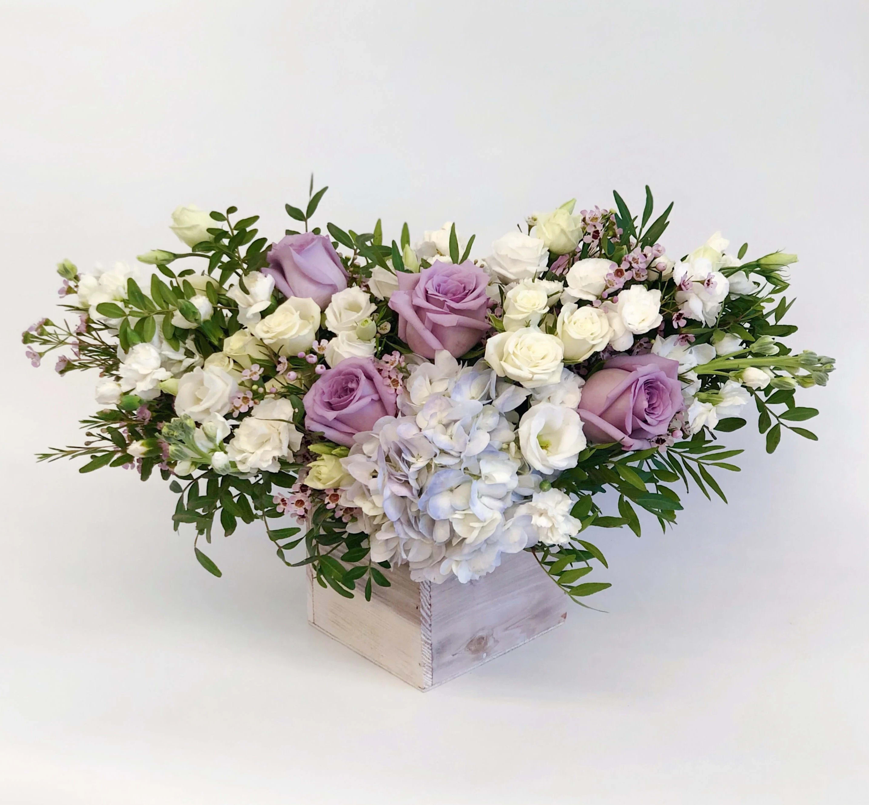 Garden Style Arrangement Lavender and White Garden Style Arrangement Lavender and White - If You want bouquet with a twist, choose our flower boxes. We have wood boxes for rustic looking arrangements, or hat boxes for a more elegant look. It’s a beautiful and convenient way. Flowers in boxes don’t need vases. That makes it perfect for transportation and keeping flowers hydrated and secure.