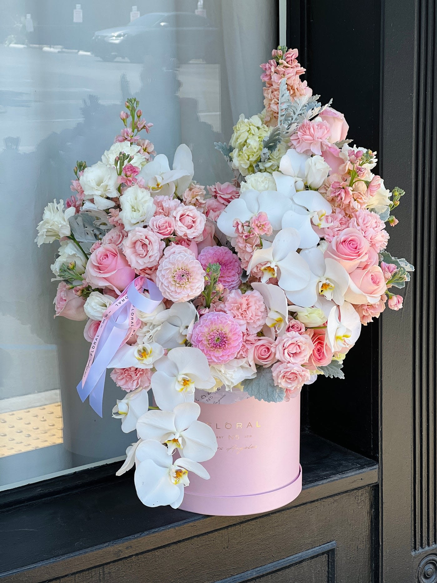 NO. 932 - PINK ORCHID BOX NO. 932 - PINK ORCHID BOX - A modern take on floral gifting, this mixed flower box is a curated blend of seasonal blooms and textures, thoughtfully designed in Studio City. Each box is a unique expression of beauty and emotion—perfect for making a lasting impression. Whether it’s a celebration or a simple gesture of love, our same day flower delivery ensures your heartfelt gift arrives fresh, elegant, and right on time. On the photo - deluxe size
