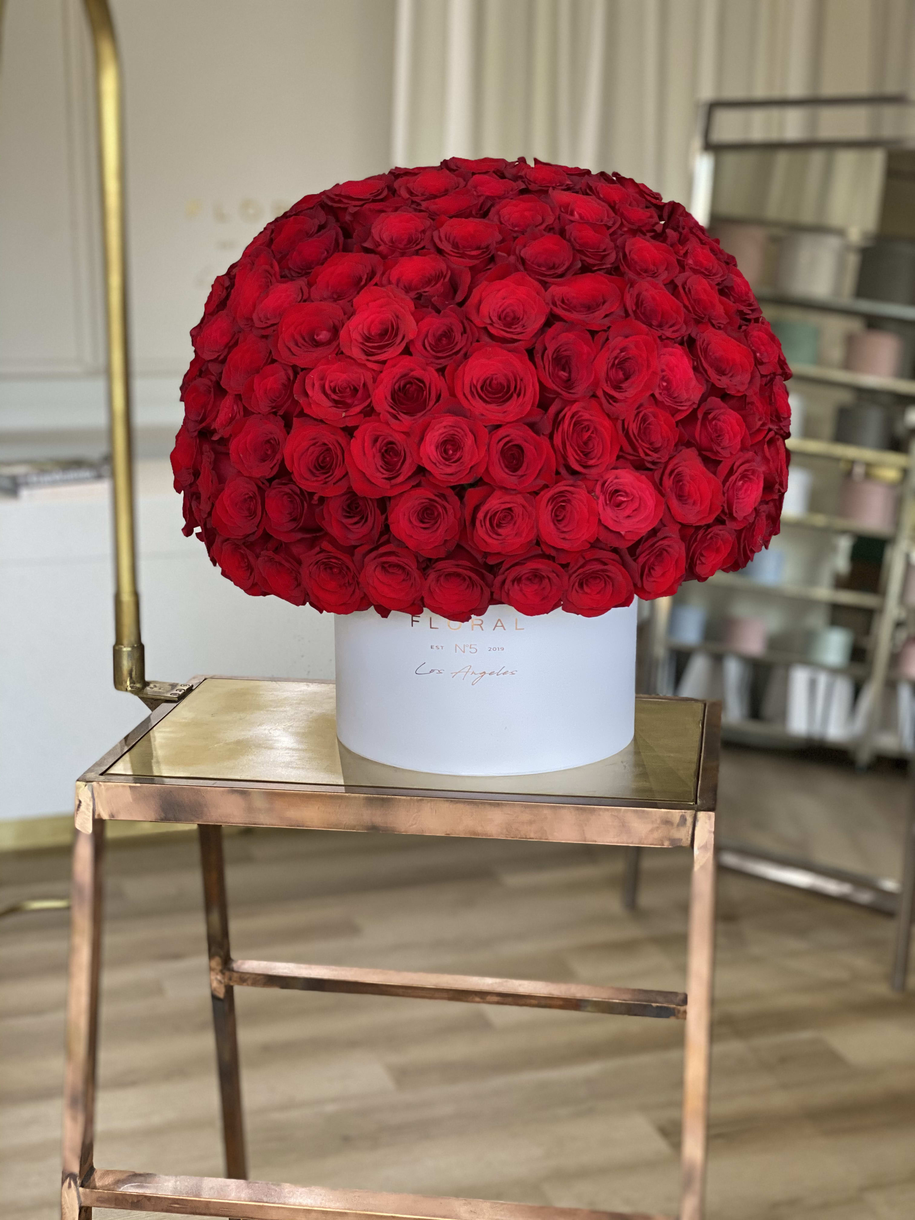 No.103 - One Hundred Red Roses No.103 - One Hundred Red Roses - Expertly arranged by our skilled florist in Studio City, this box of 100 classic roses offers a modern twist on a timeless gesture. Elegant and refined, it's the perfect gift for any occasion. With same day flower delivery available, sending a stunning floral surprise has never been easier. Experience the beauty and sophistication of a luxurious rose presentation. 100 Red Roses in our signature luxury box.