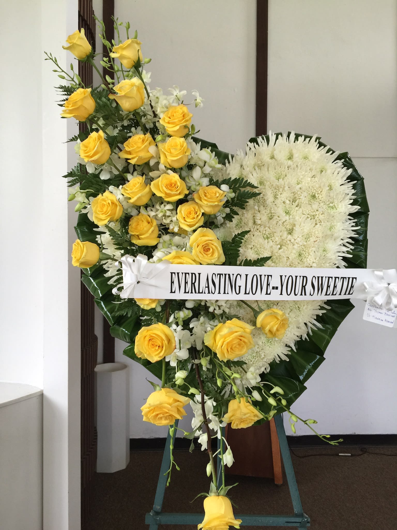 Everlasting Love - W30050 - Beautiful heart-shaped wreath with white spidermums and yellow rose cascade, accented with white dendrobium sprays. 