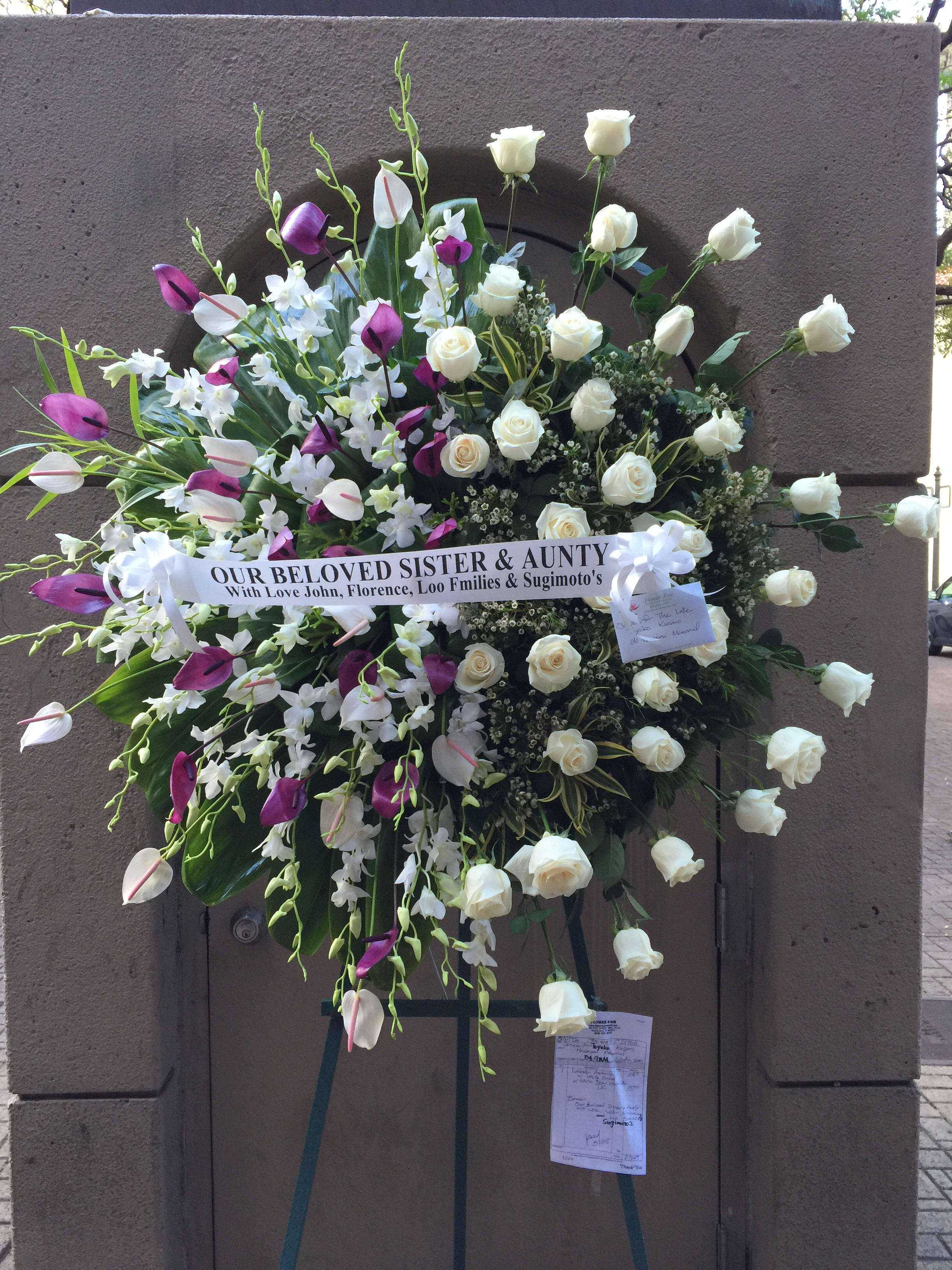 Full burst of half Roses and half Anthriums & Orchids - F30020 Full burst of half Roses and half Anthriums & Orchids - F30020 - Grand spread of soft cream Roses with babies breath on one side and tropical arrangement of Anthriums & Orchids artfully display on the other side.