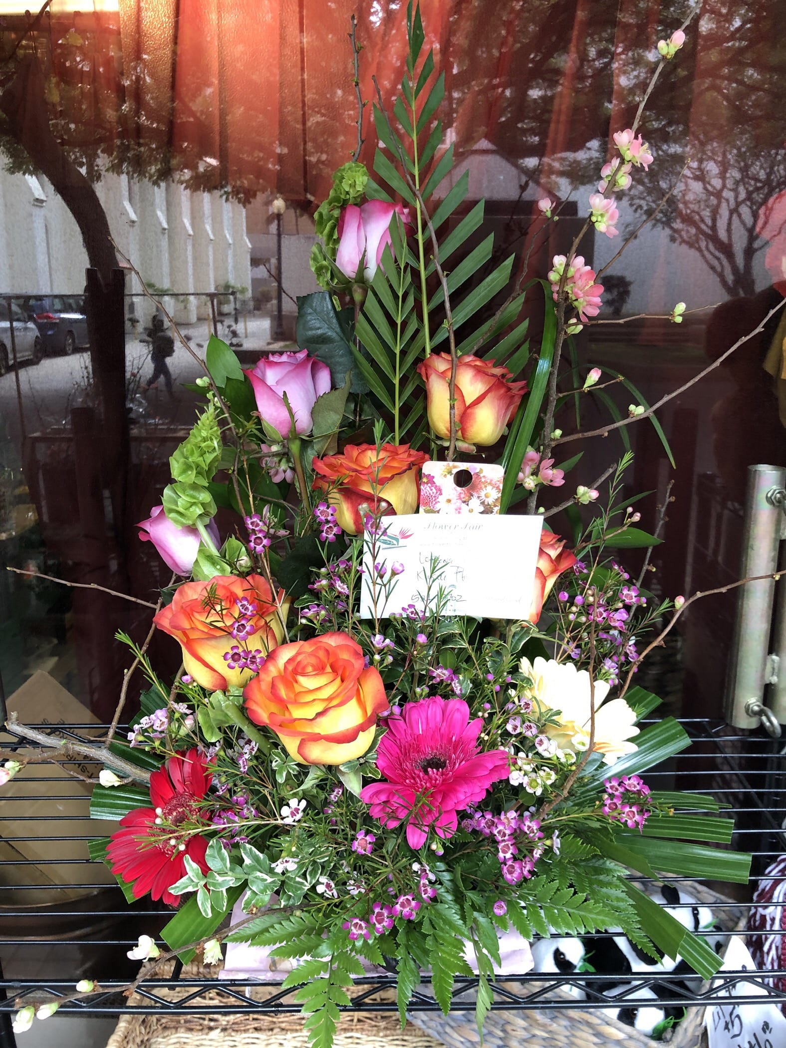 Roses and Gerbera Daisy arrangement BQ005 - Colorful and artful arrangement of roses and Gerbera daisy with cherry blossoms added the spectacular statement 